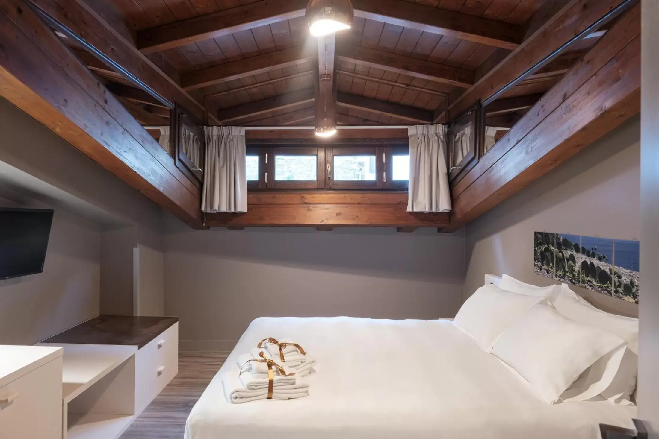 Bed in Il Casato Deluxe Rooms