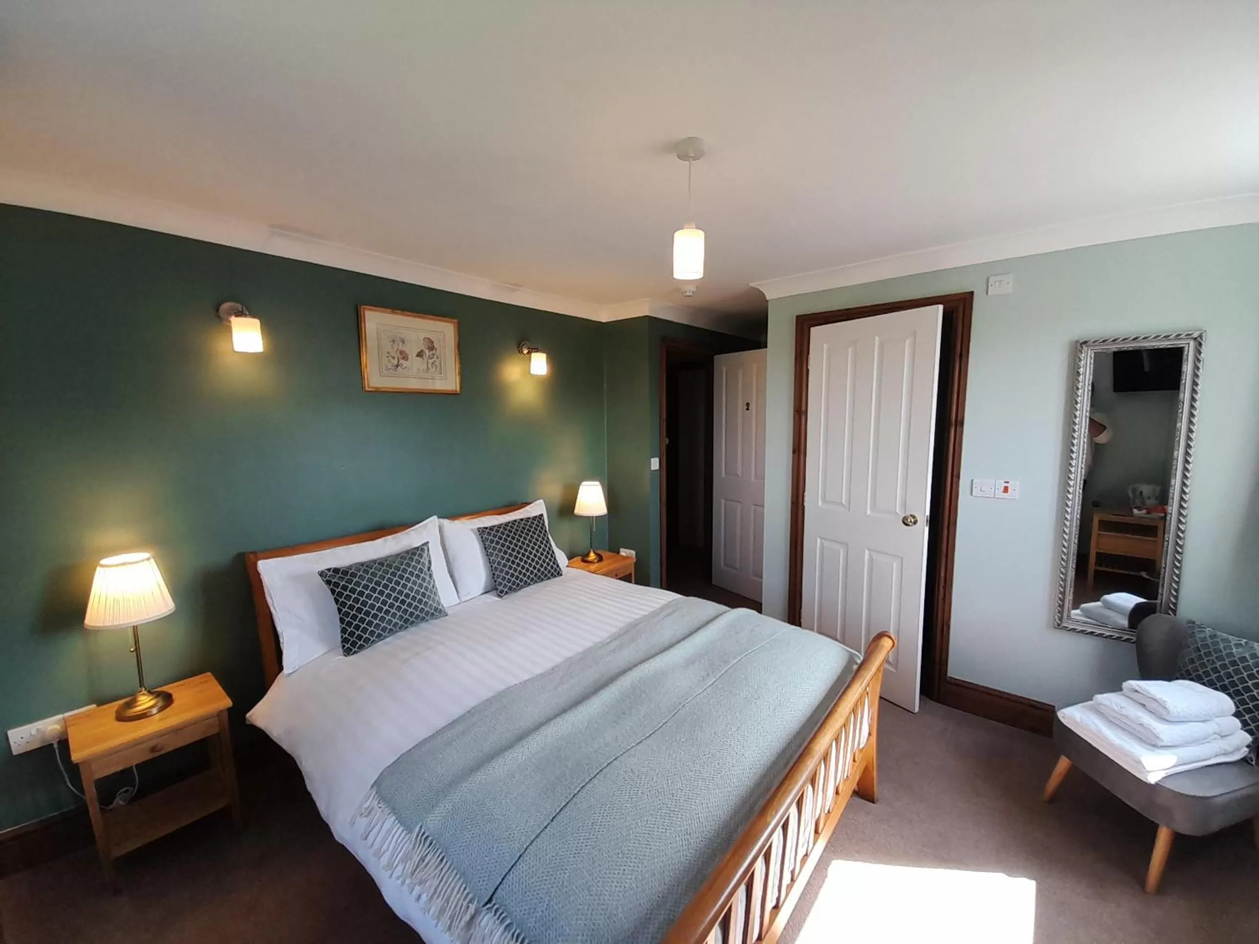 Bed in The Dolfor Inn