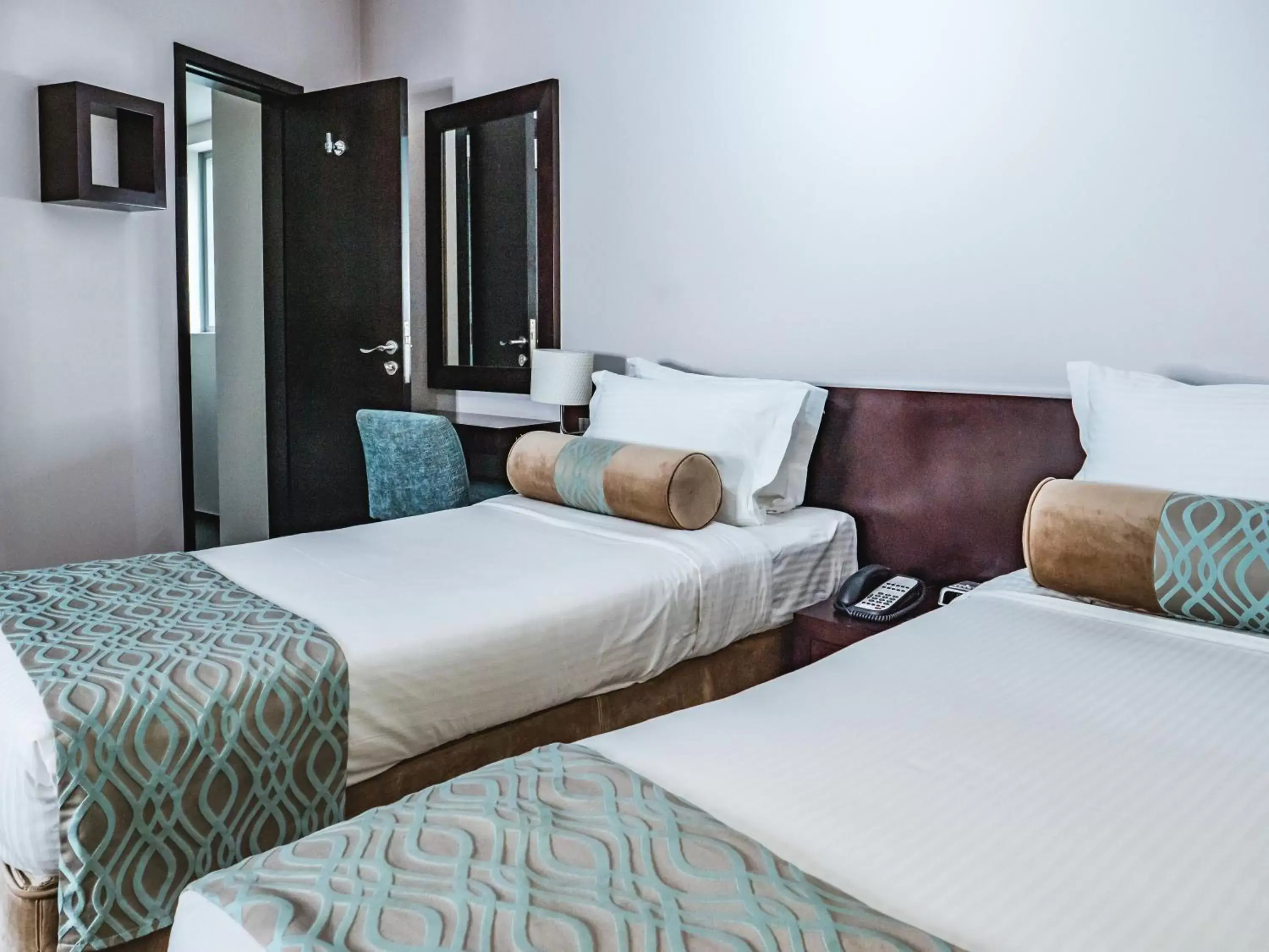 Bed in Signature Hotel Apartments and Spa