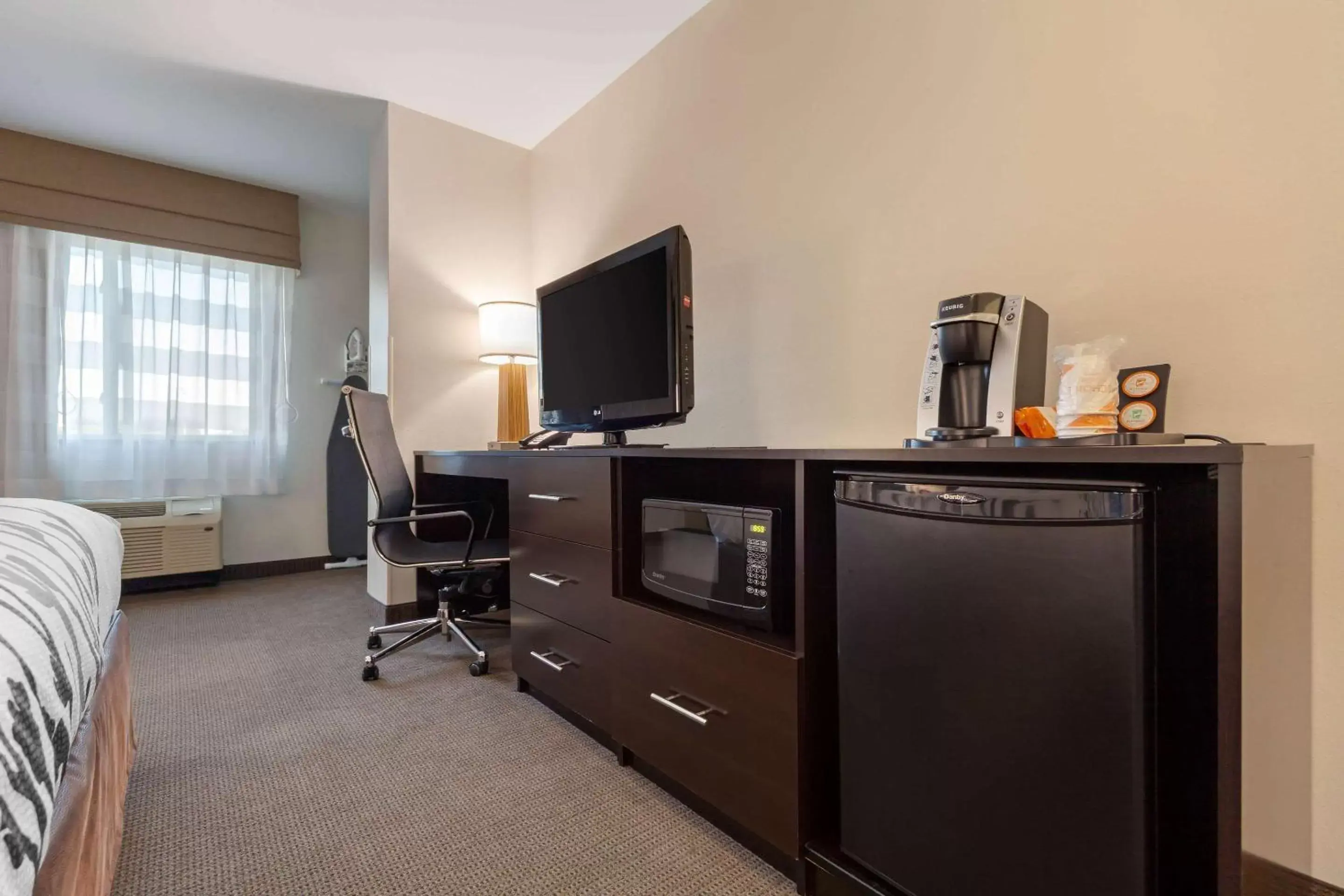 Photo of the whole room, TV/Entertainment Center in Sleep Inn & Suites Bismarck I-94