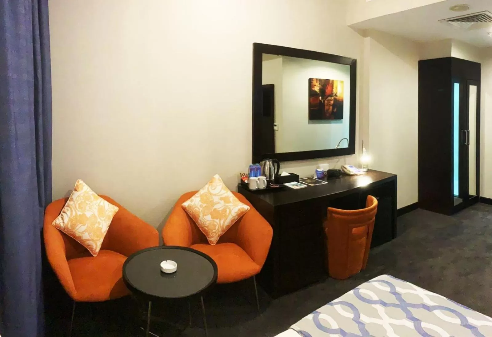 Seating area, Bed in Ramada Encore Doha by Wyndham