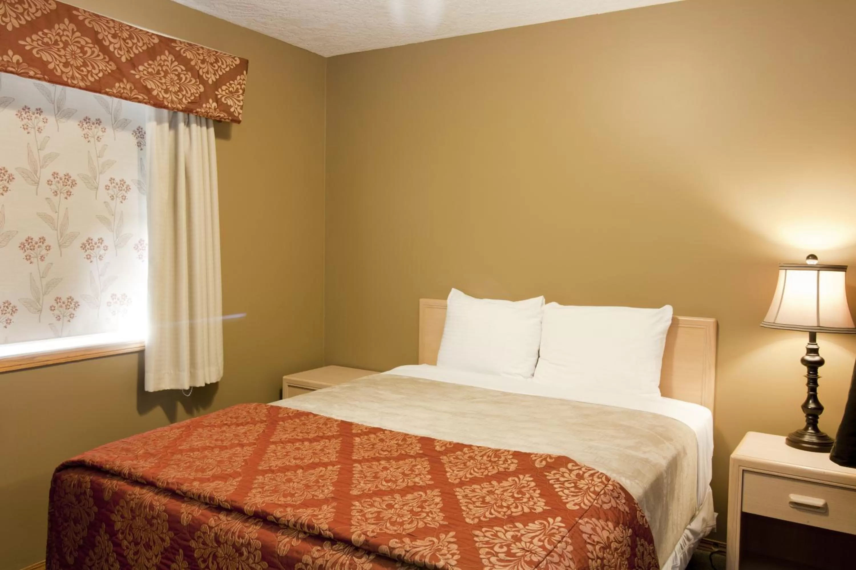 Bed in Bow River Inn