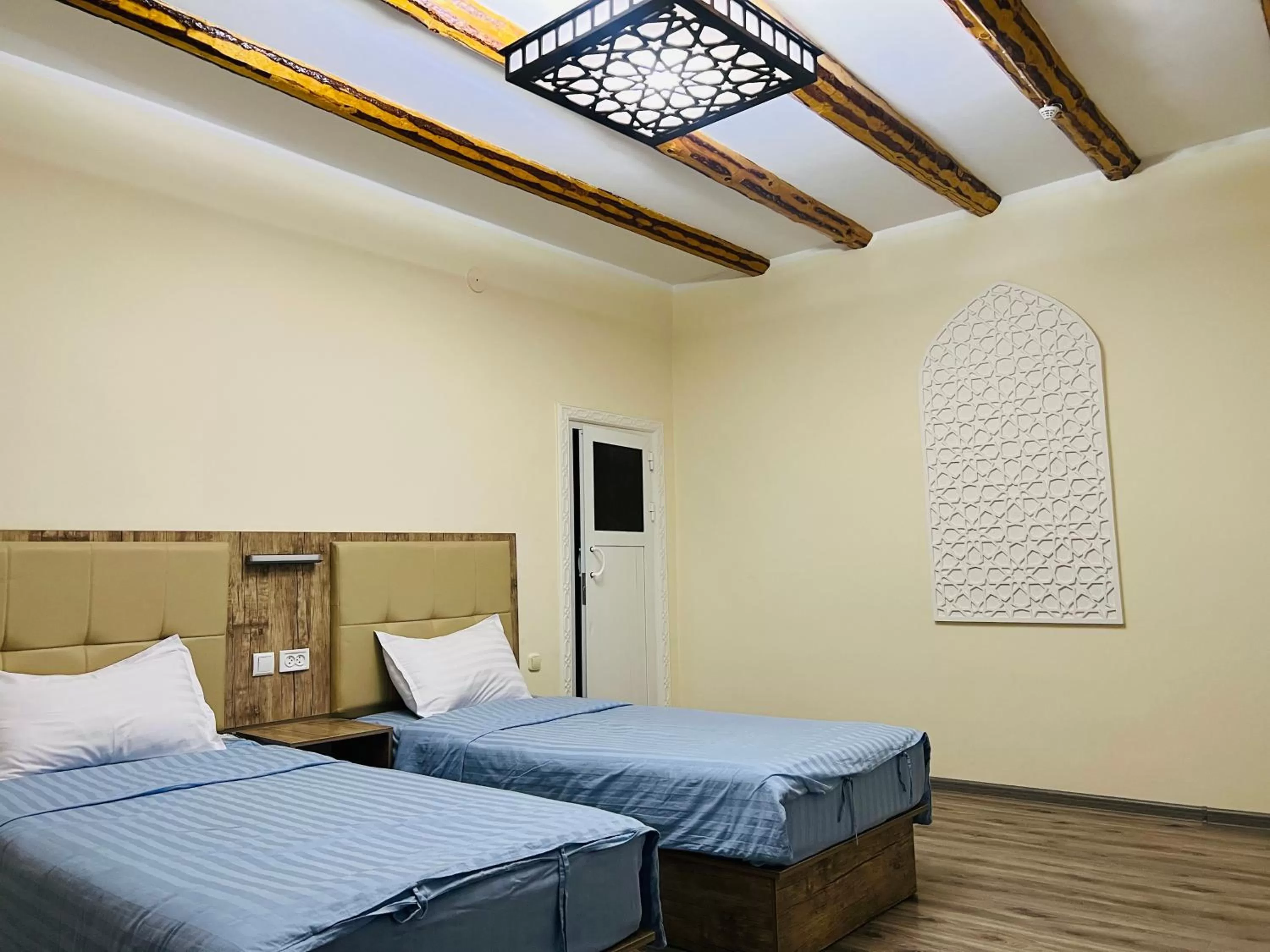 View (from property/room), Bed in Bukhara house hotel