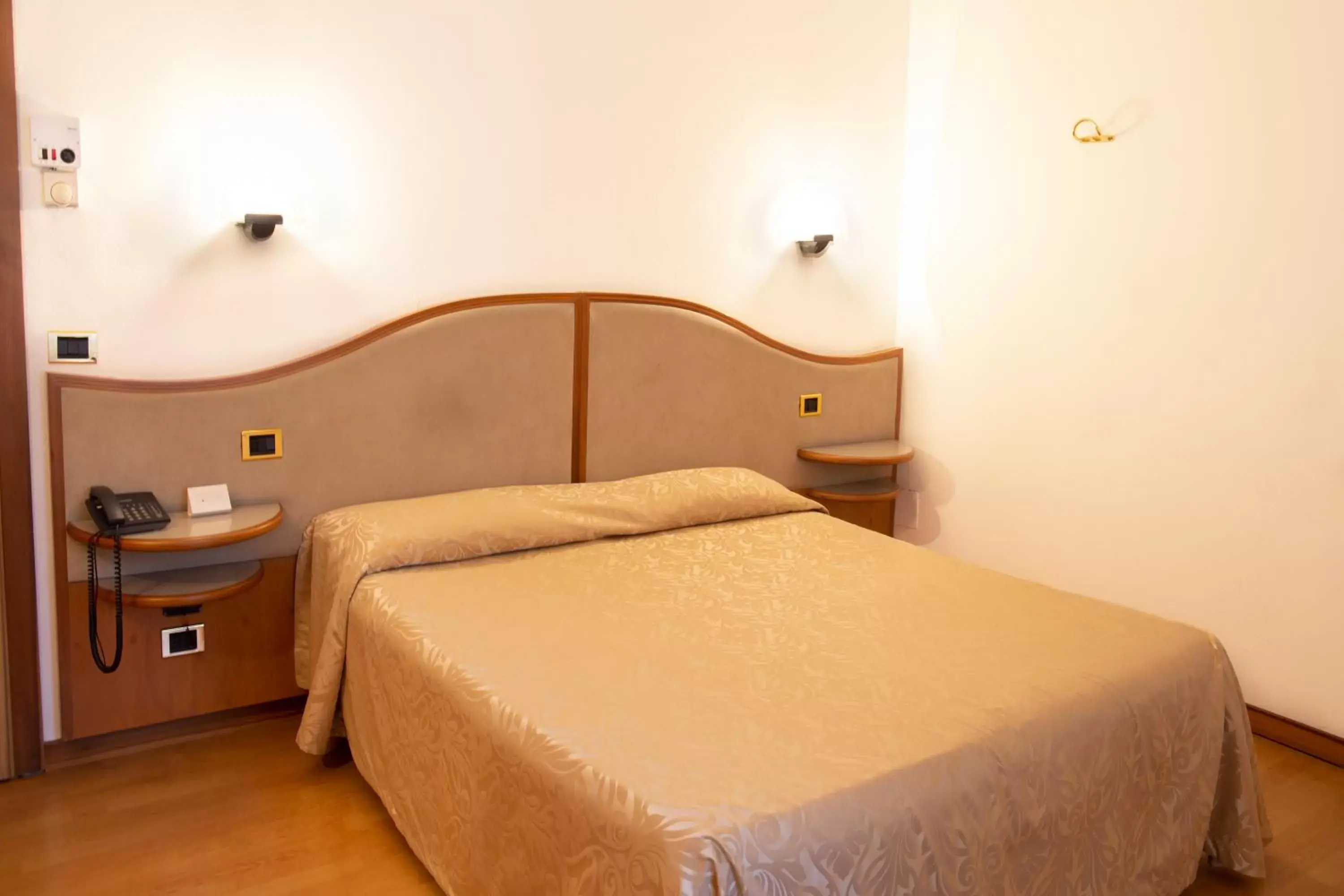 Bed in Albergo Milano