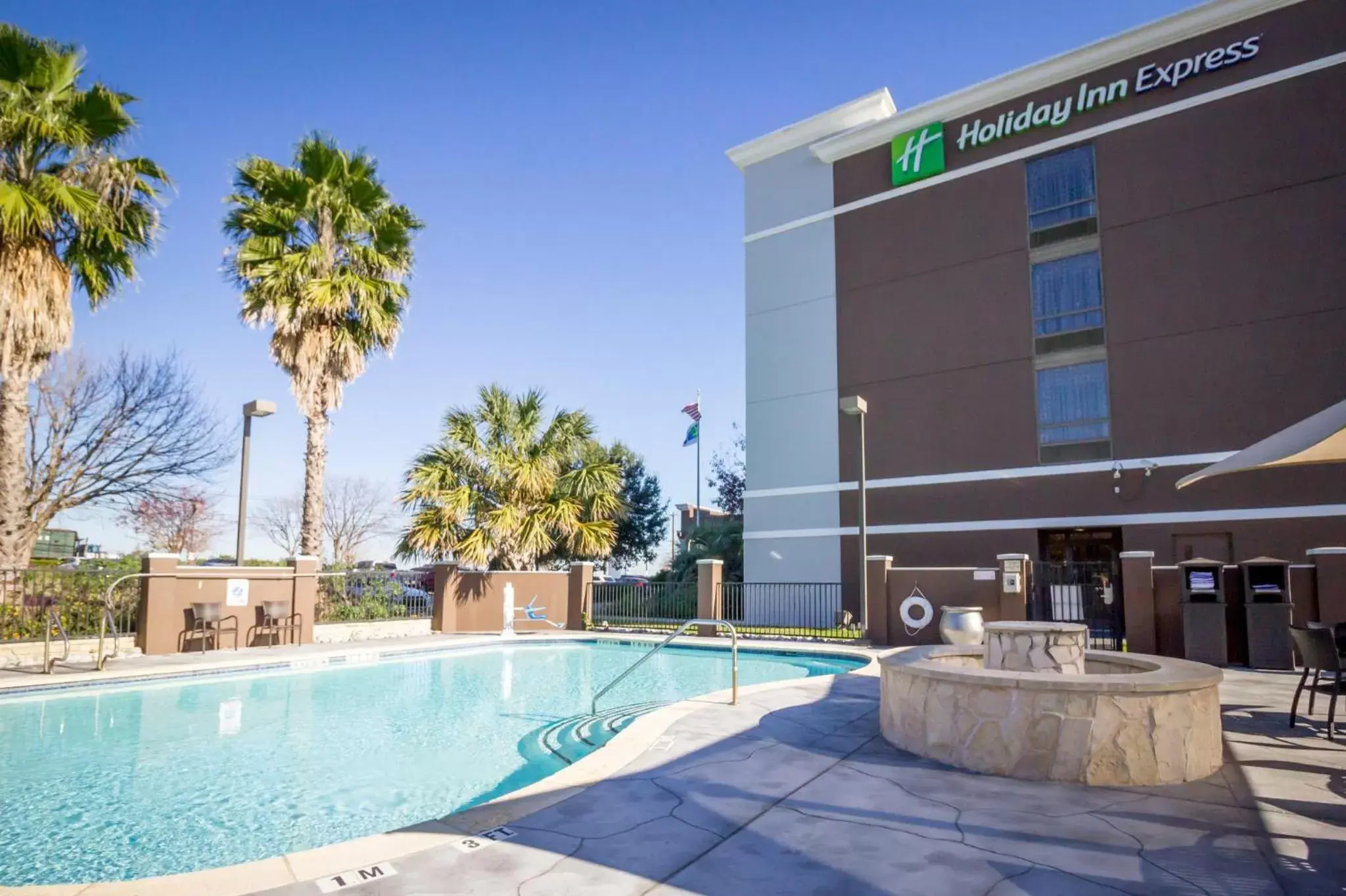 Swimming pool, Property Building in Holiday Inn Express Hotel & Suites Austin Airport, an IHG Hotel