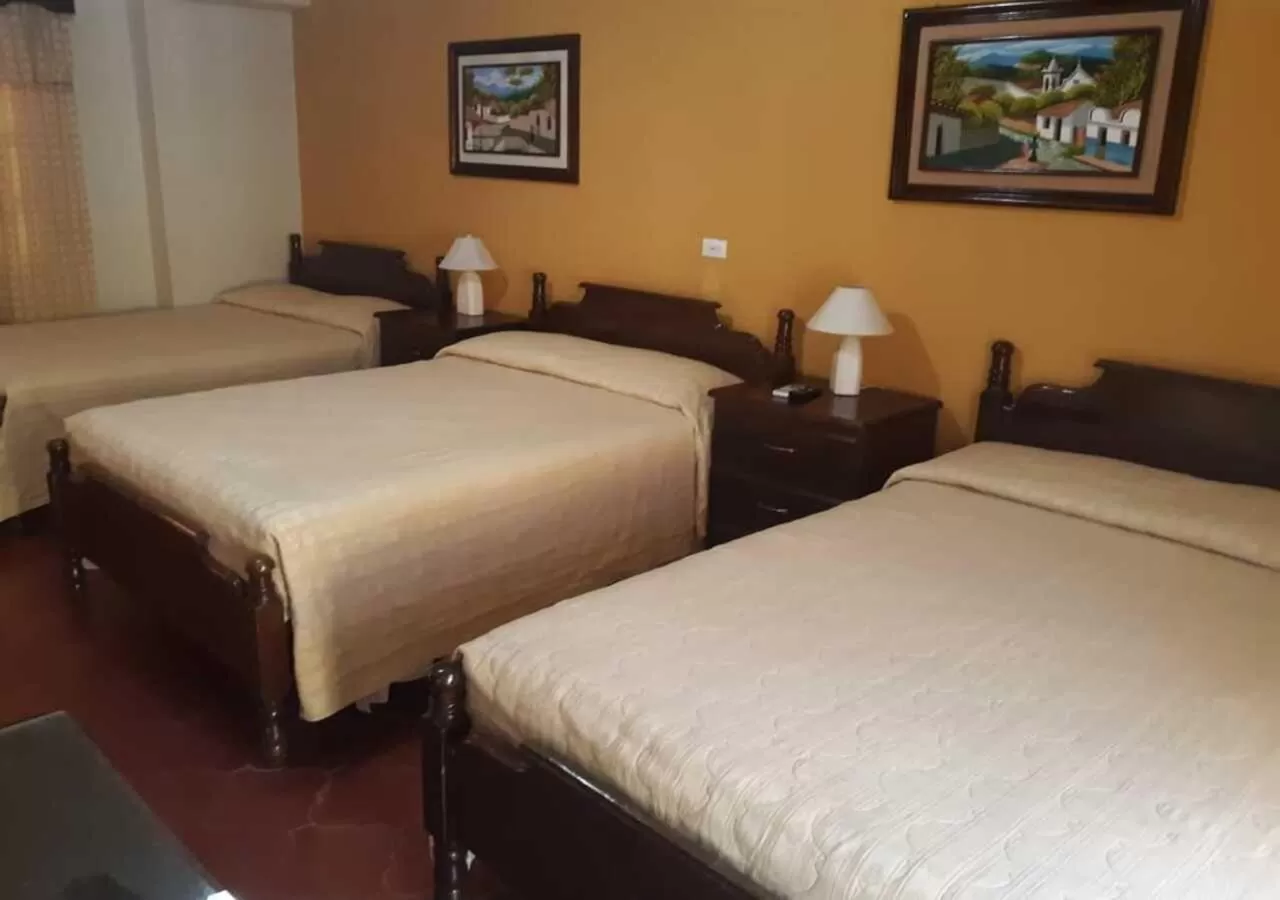 Bed in Hotel Acropolis Maya