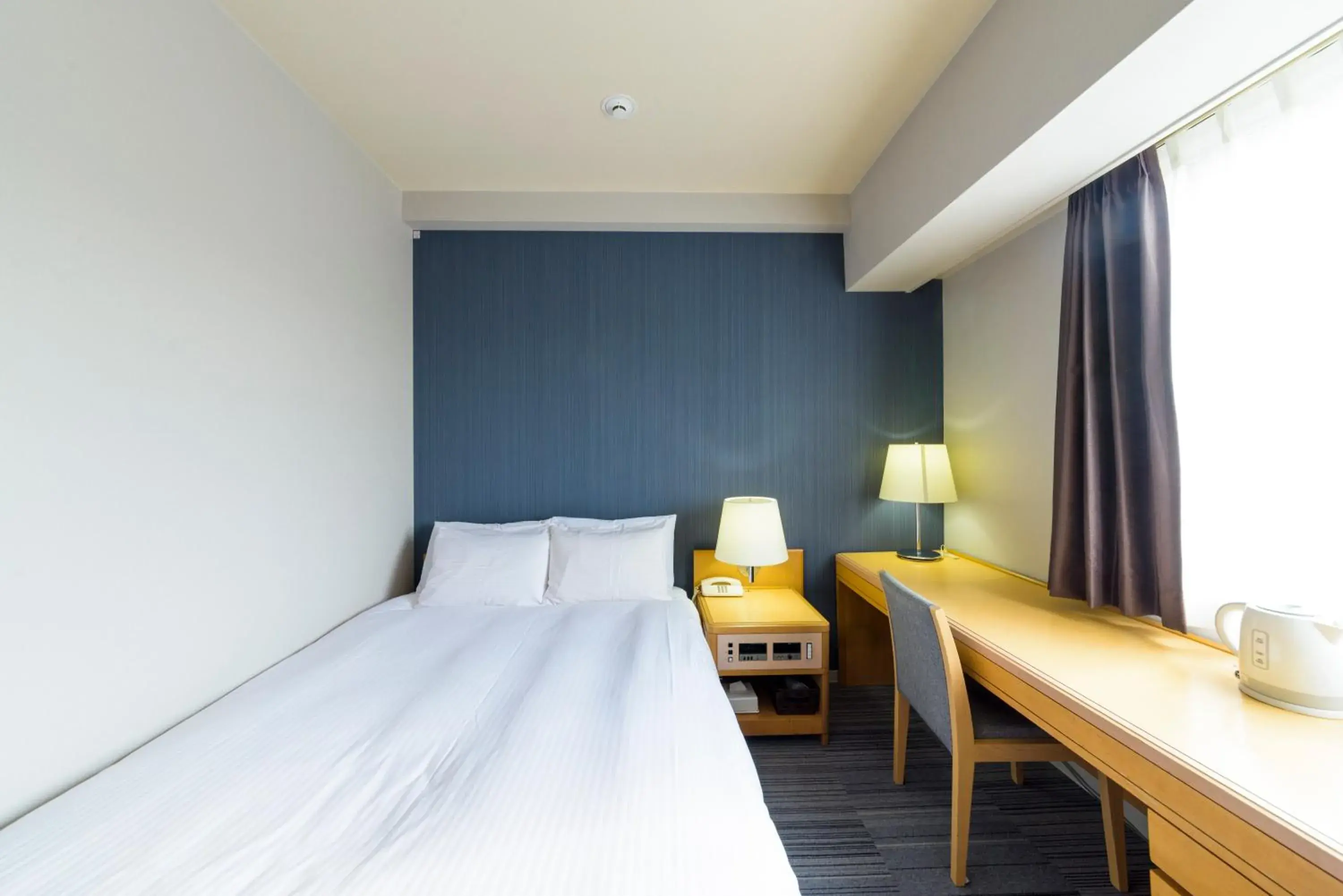 Bed in SureStay Plus Hotel by Best Western Shin-Osaka