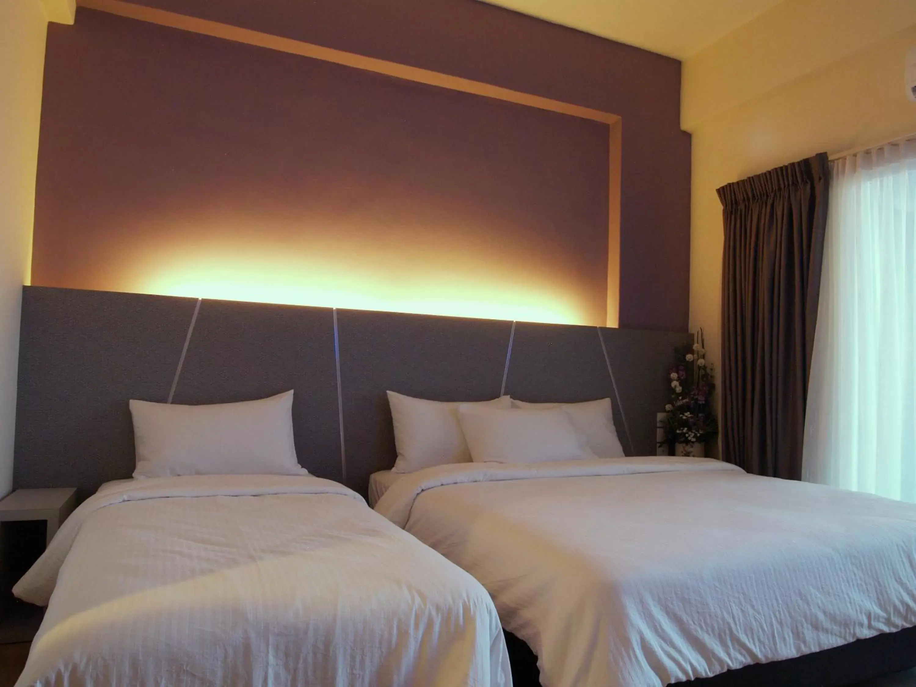 Bed in Marvelux Hotel