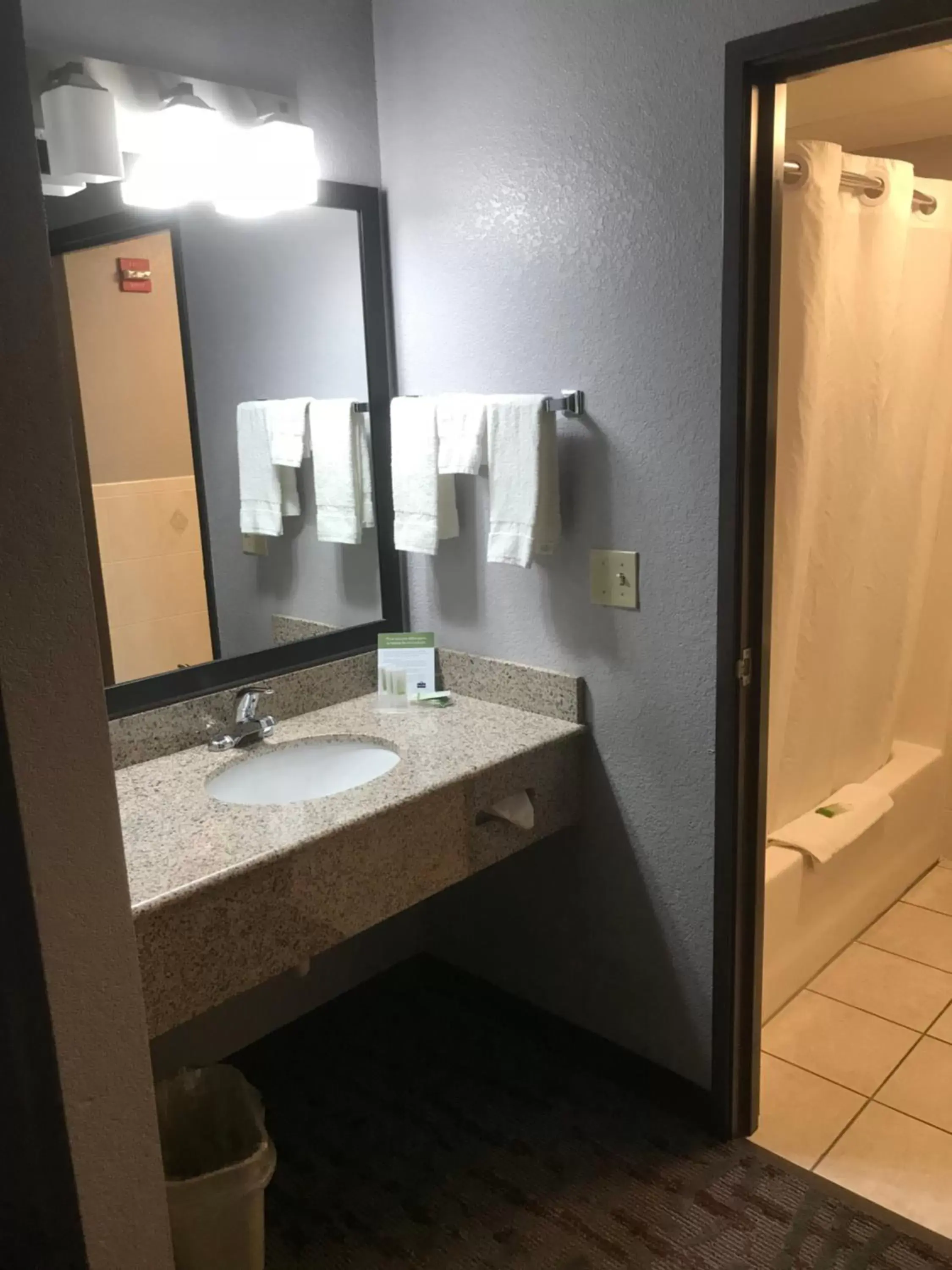 Bathroom in AmericInn by Wyndham Ankeny/Des Moines