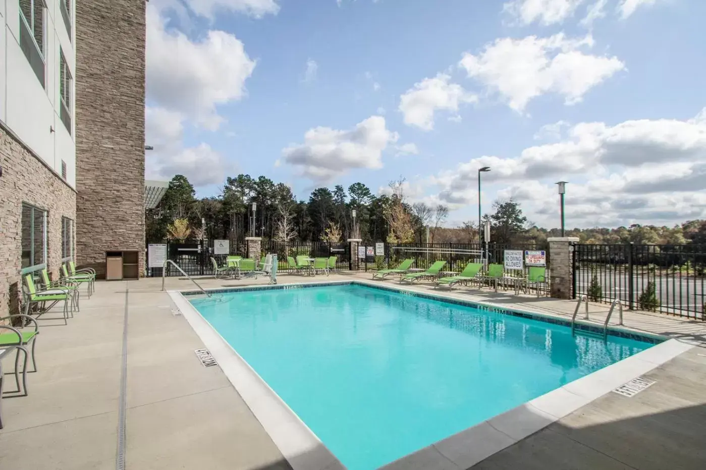 Pool view in Holiday Inn Express & Suites Charlotte Southwest, an IHG Hotel