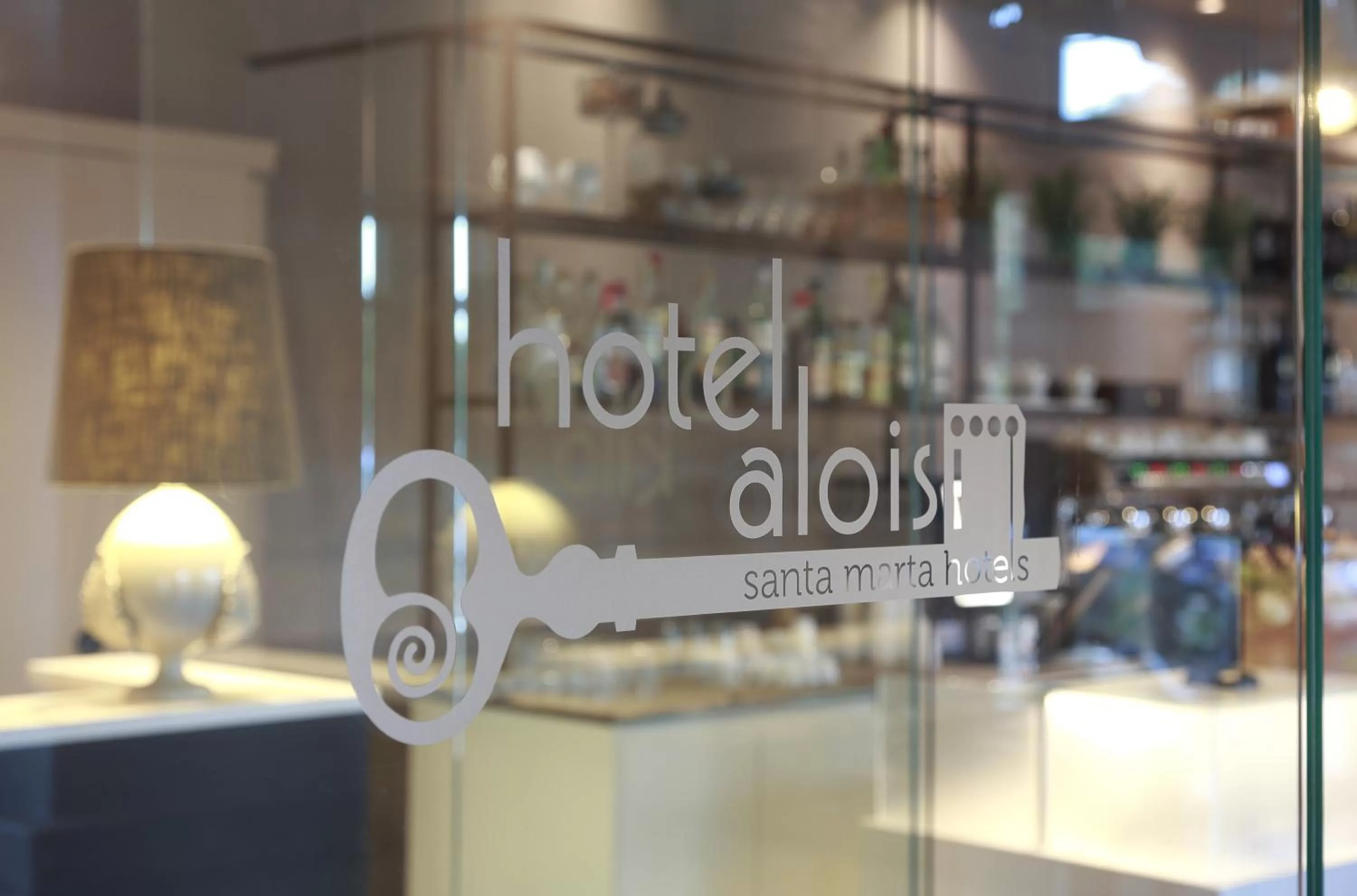 Property logo or sign in Hotel Aloisi