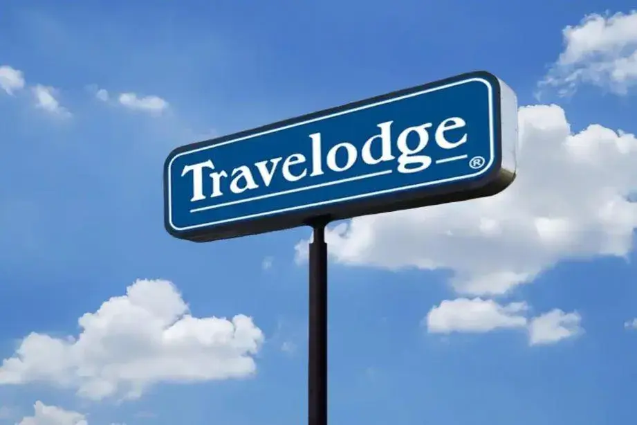 Property logo or sign in Travelodge by Wyndham Livonia Canton Novi Detroit Area
