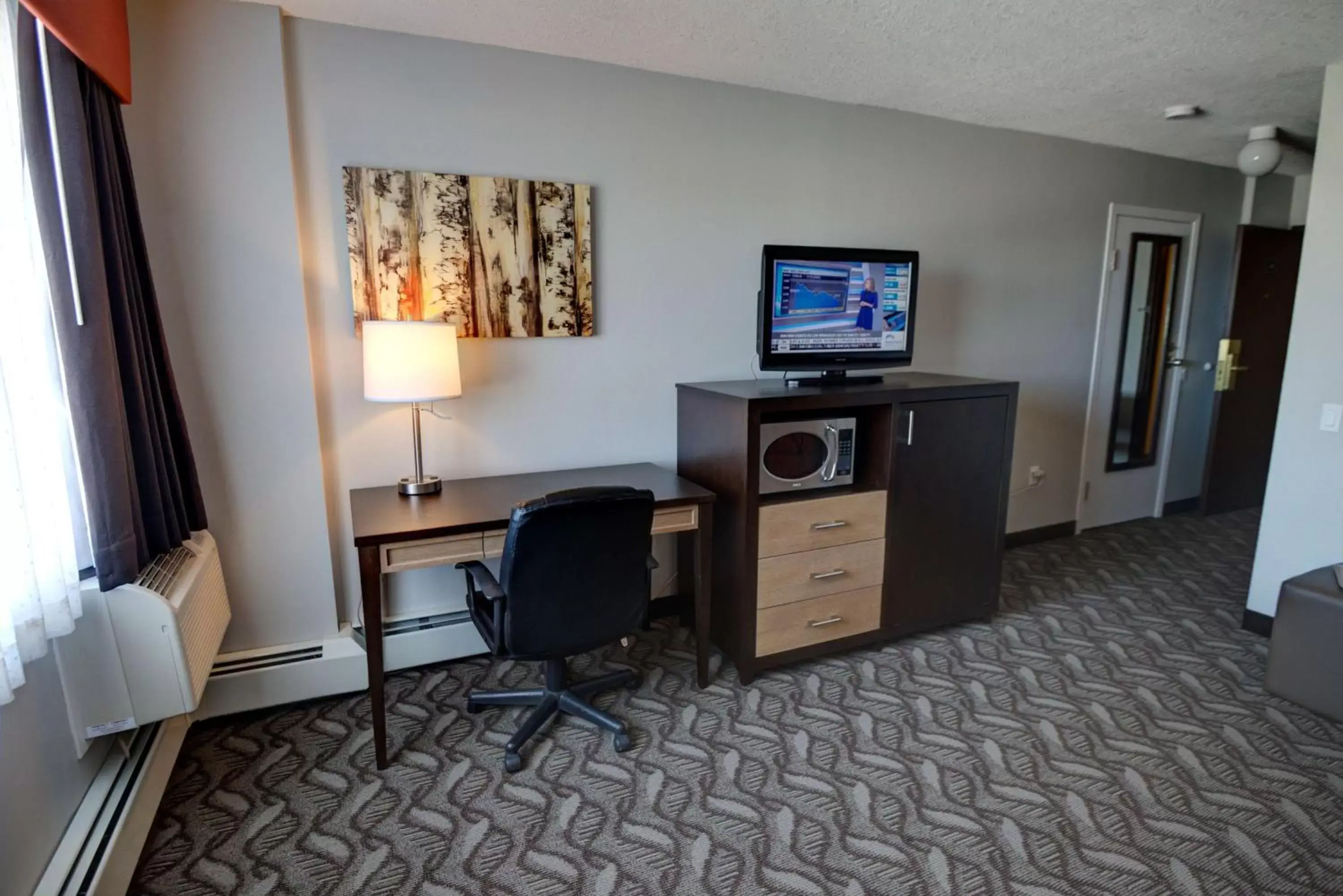 Photo of the whole room, TV/Entertainment Center in Best Western Airdrie