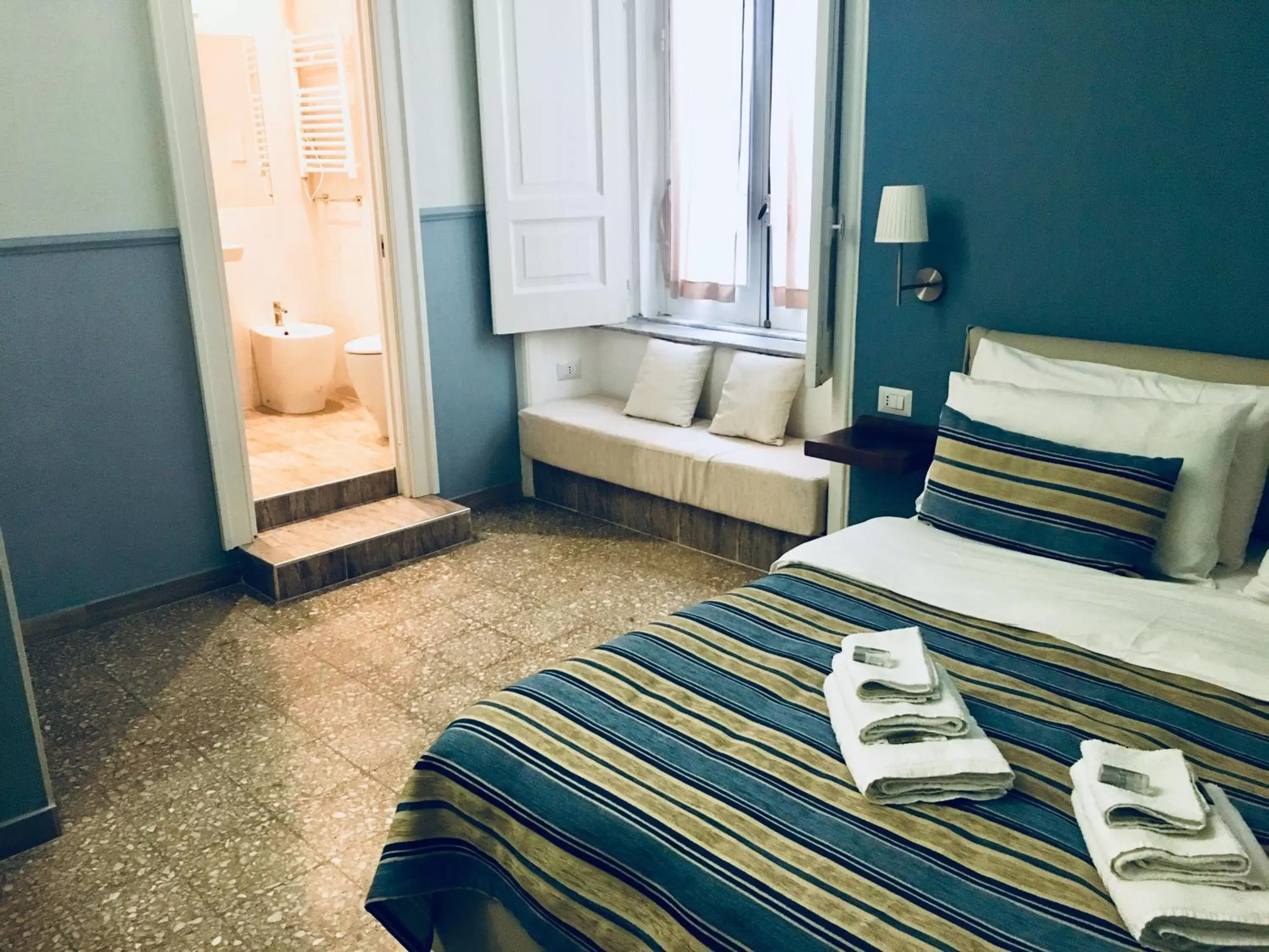 Bed in Aragonese Luxury Rooms