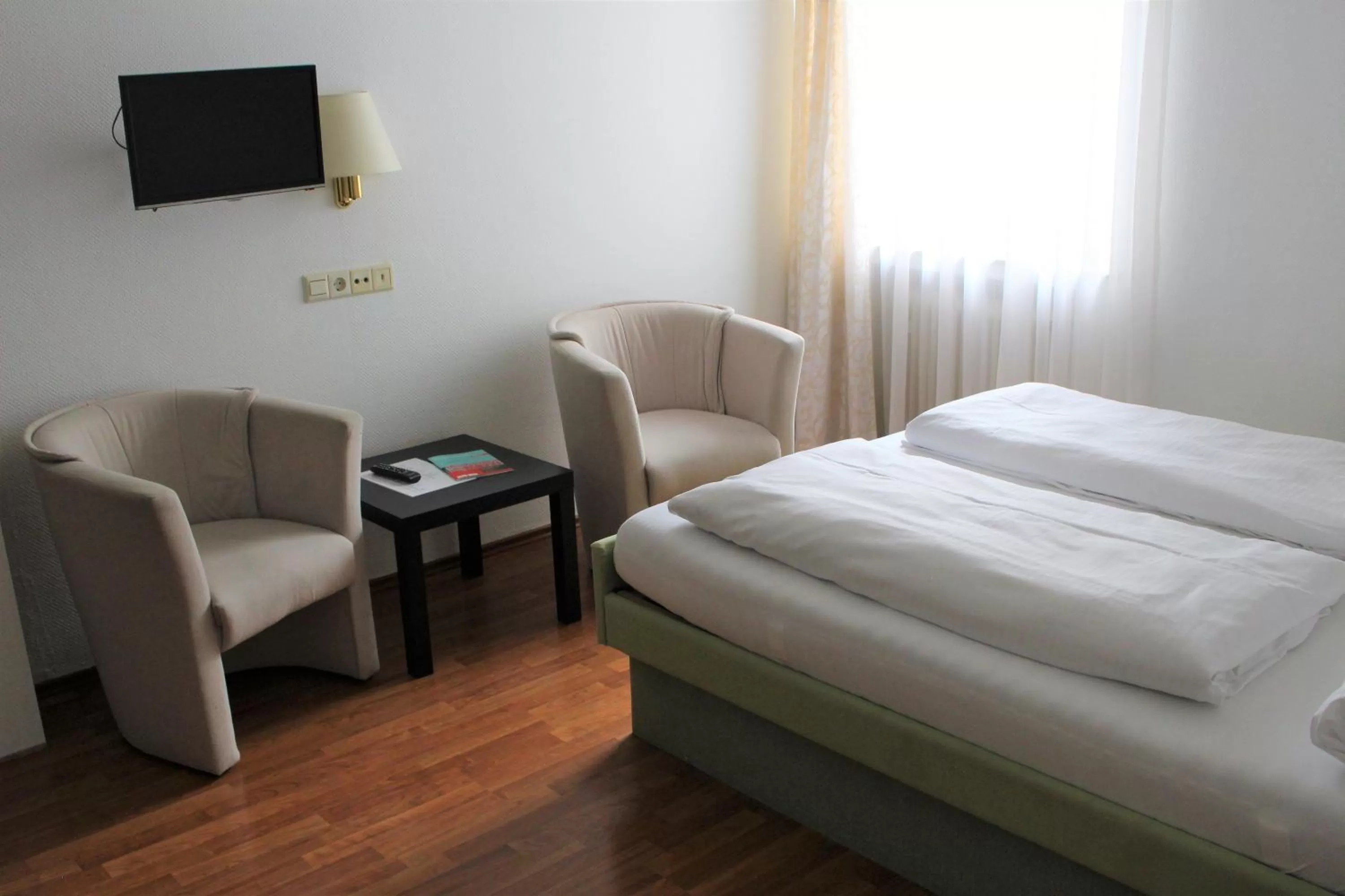 Bed in Hotel Ulmer Spatz