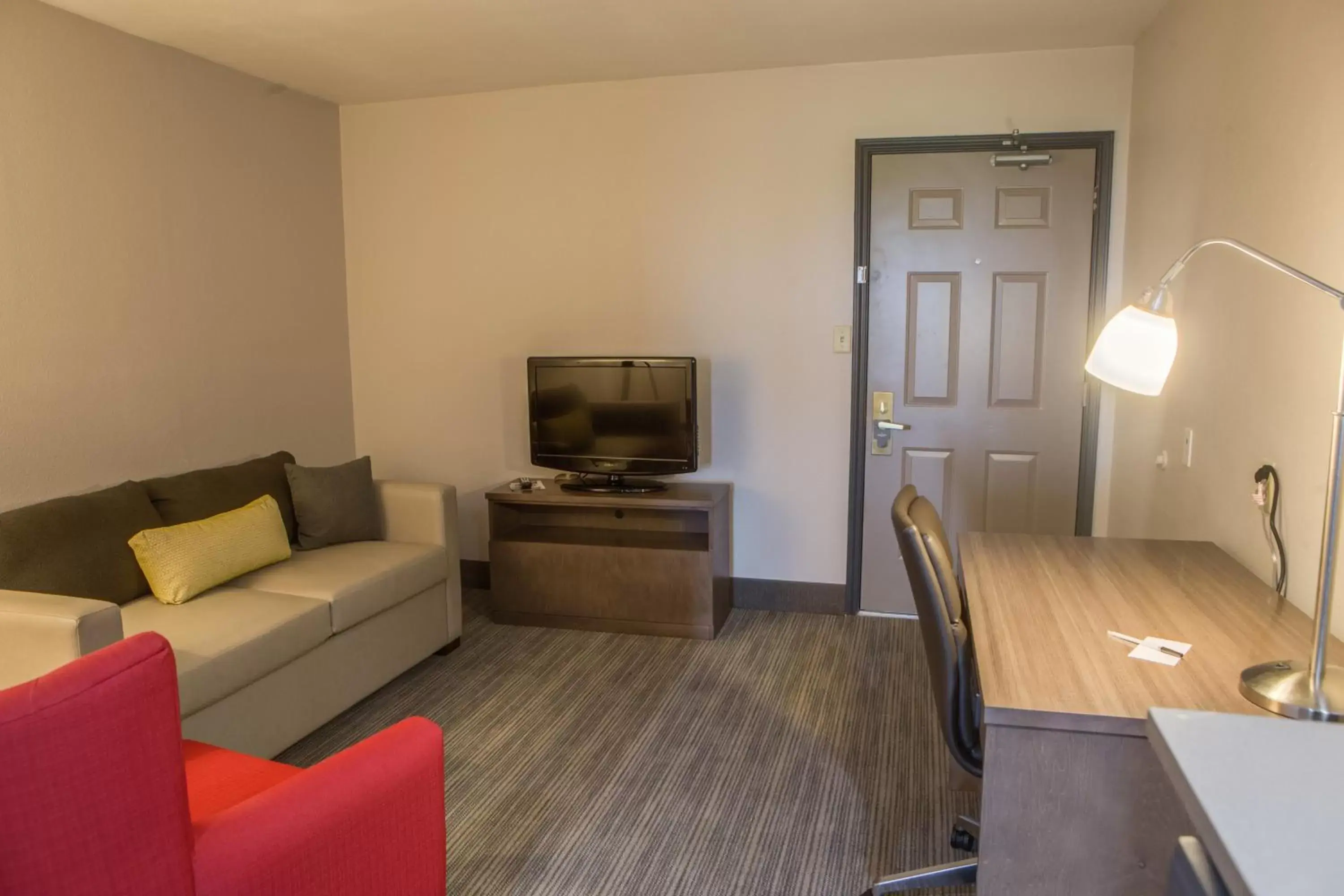 Living room, TV/Entertainment Center in Country Inn & Suites by Radisson, Harlingen, TX