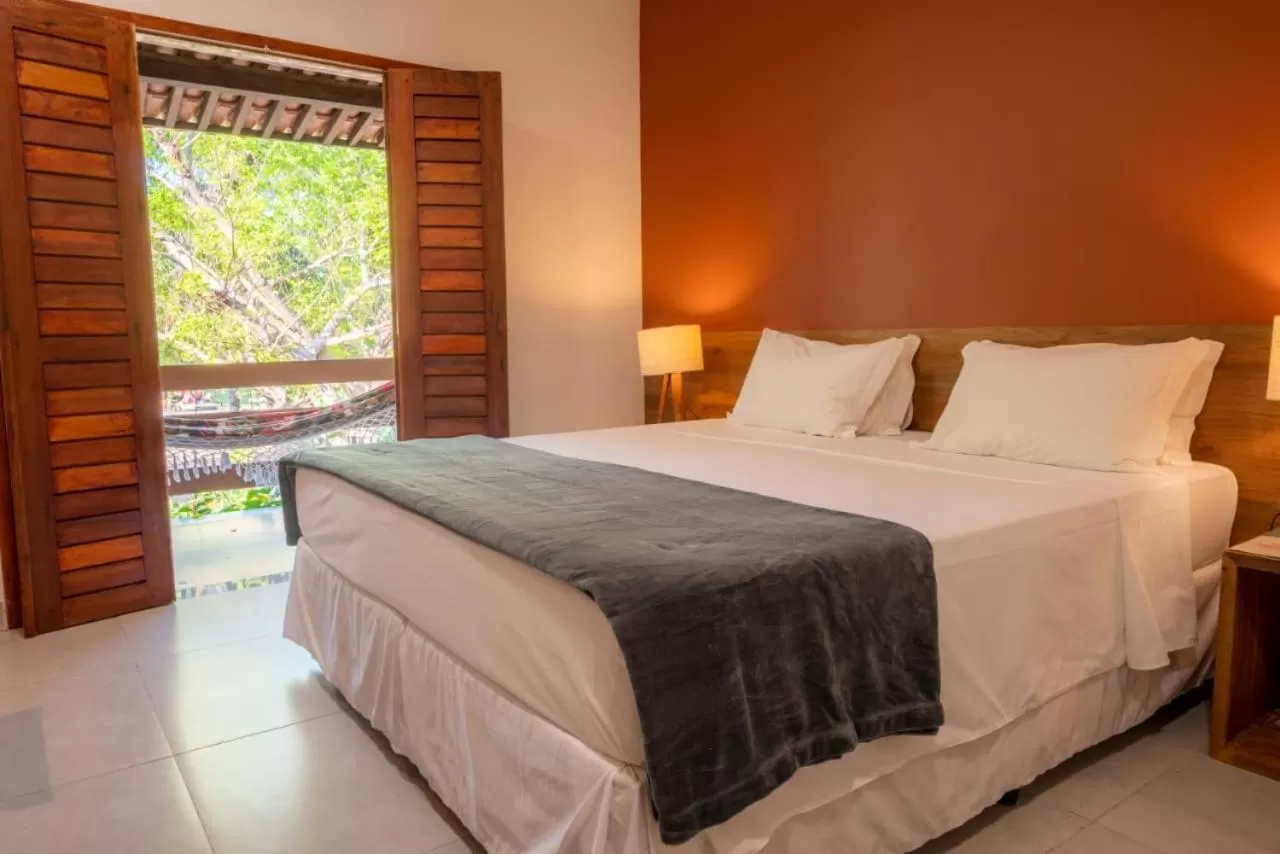 Garden view, Bed in Angá Beach Hotel