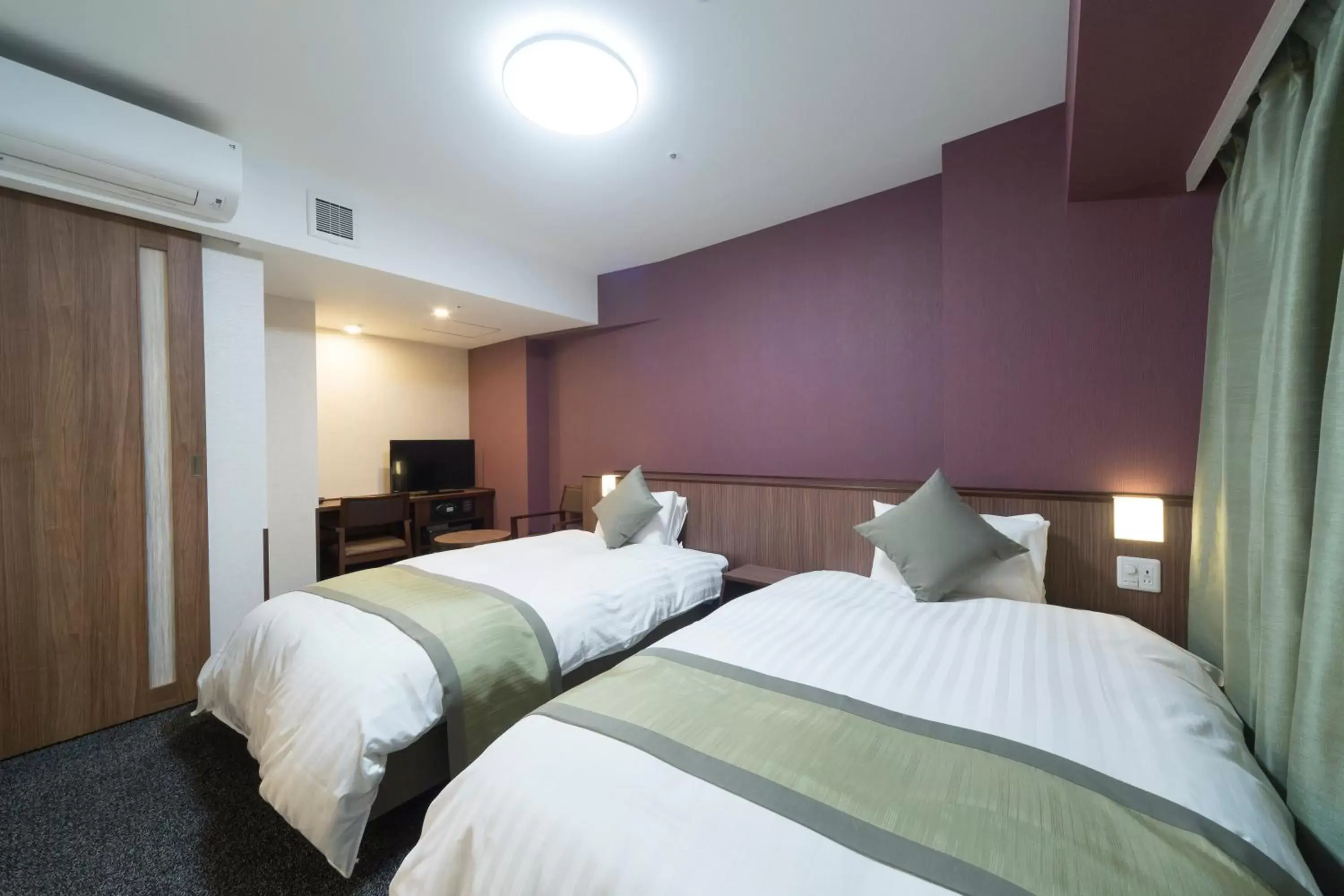 Bed in Myoujin-no-Yu Dormy Inn Premium Kanda