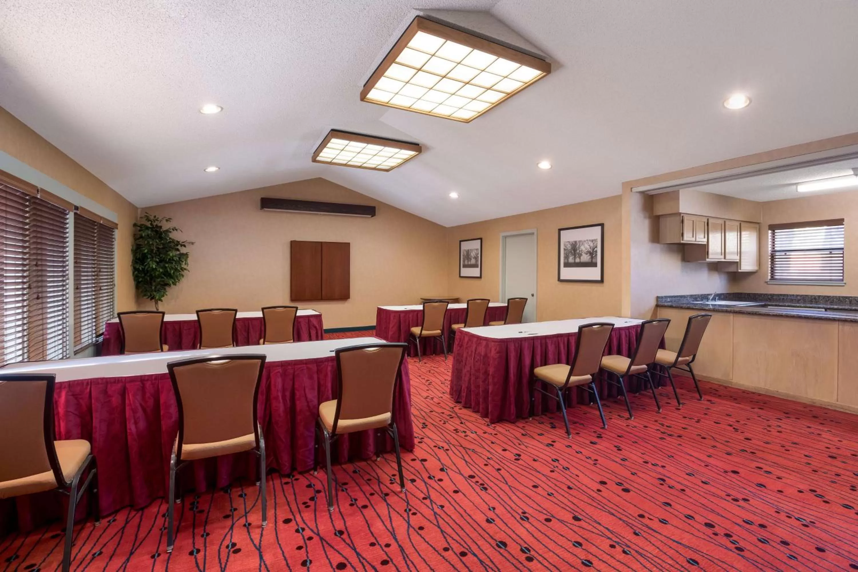 Meeting/conference room in SenS Suites Livermore; SureStay Collection by Best Western