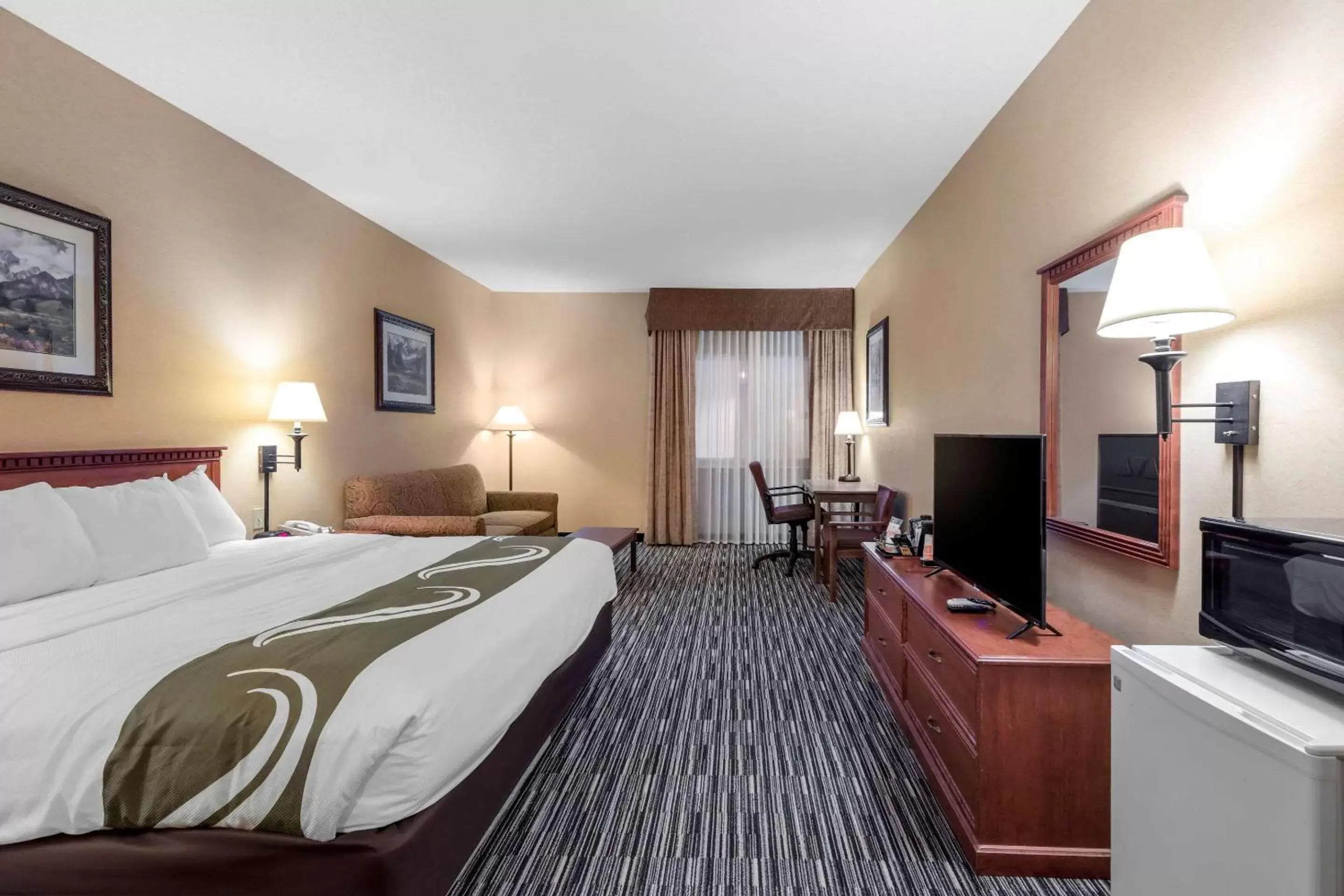 Bedroom in Quality Inn & Suites Wellington – Fort Collins