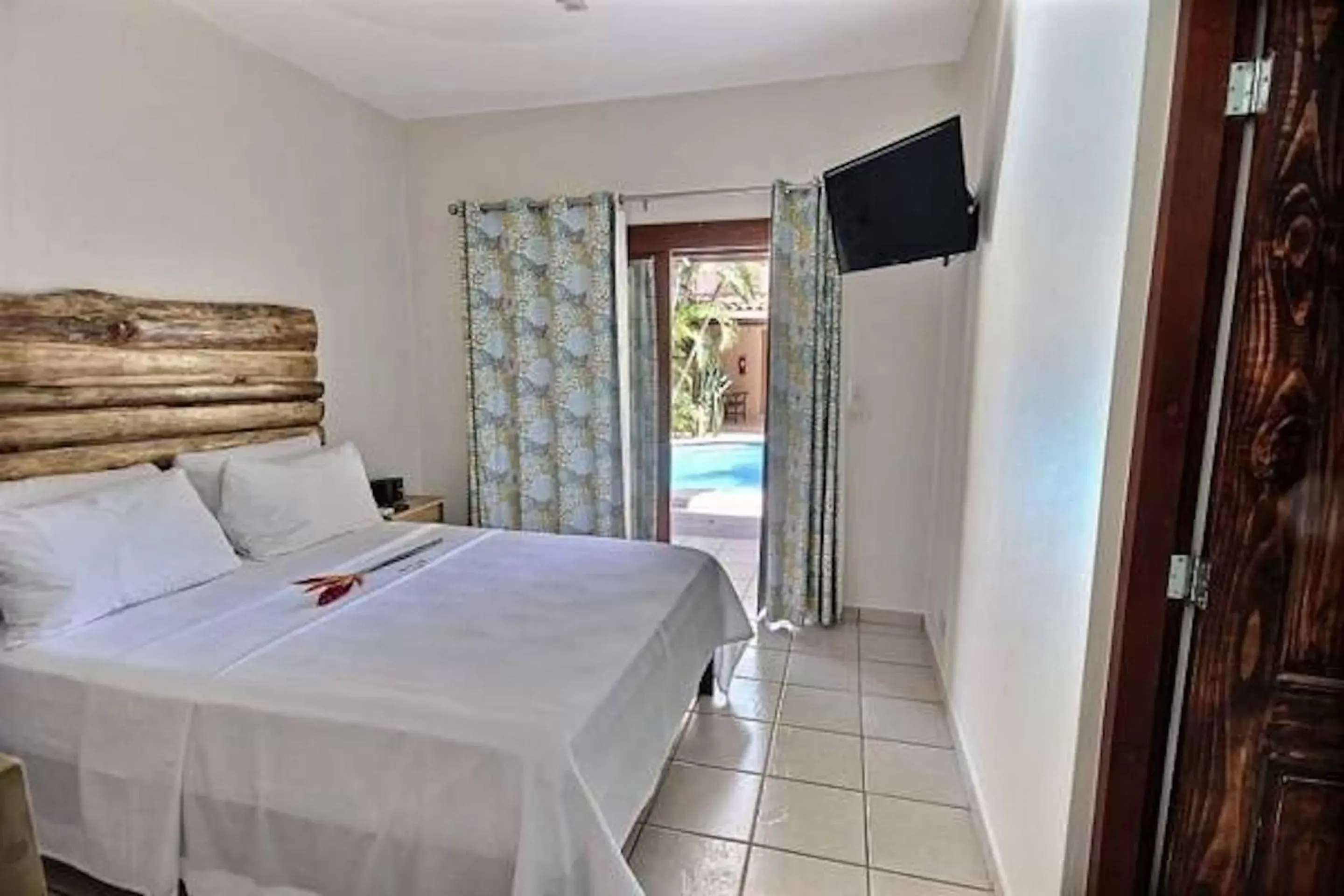 Bed in Ten North Tamarindo Beach Hotel