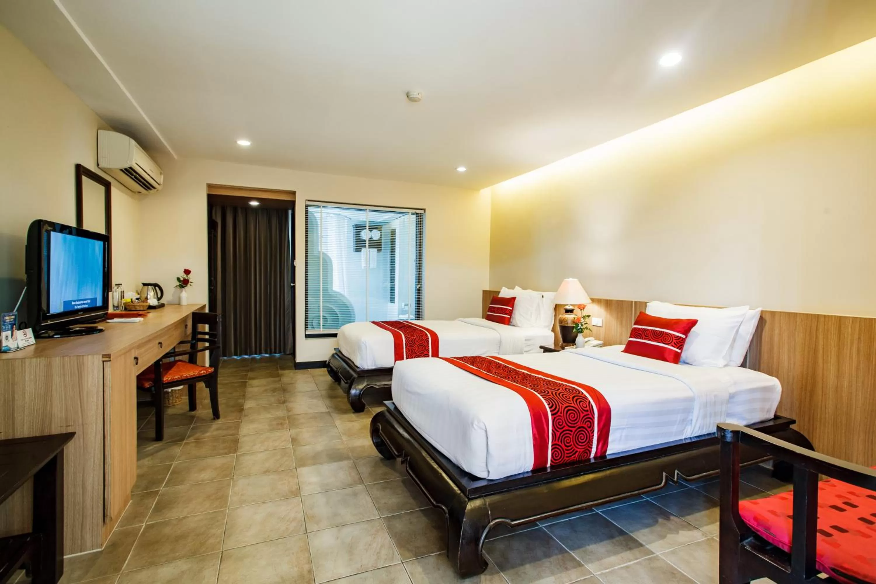 Bed in Raming Lodge Hotel