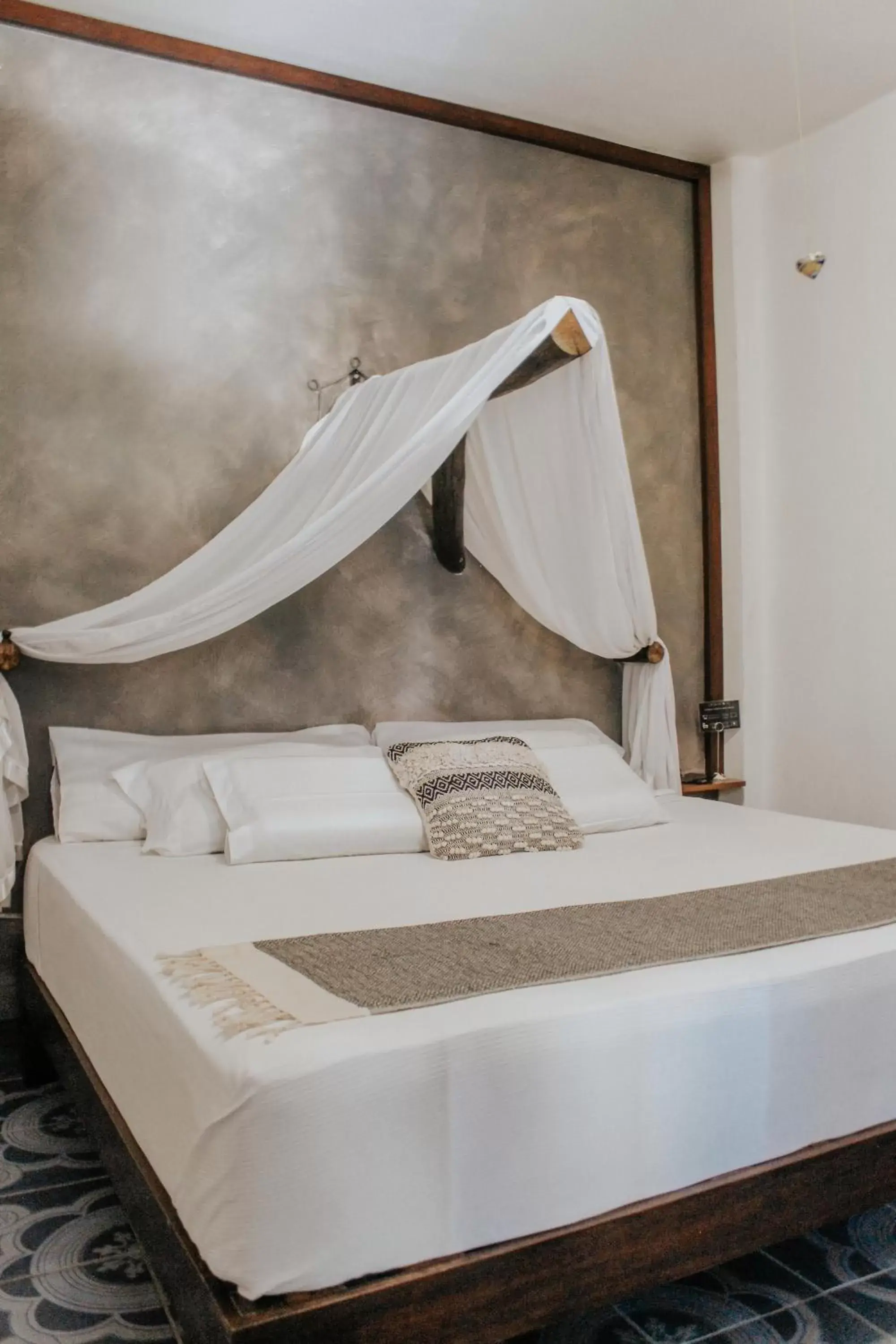 Bed in Casa de Olas Boutique Hotel