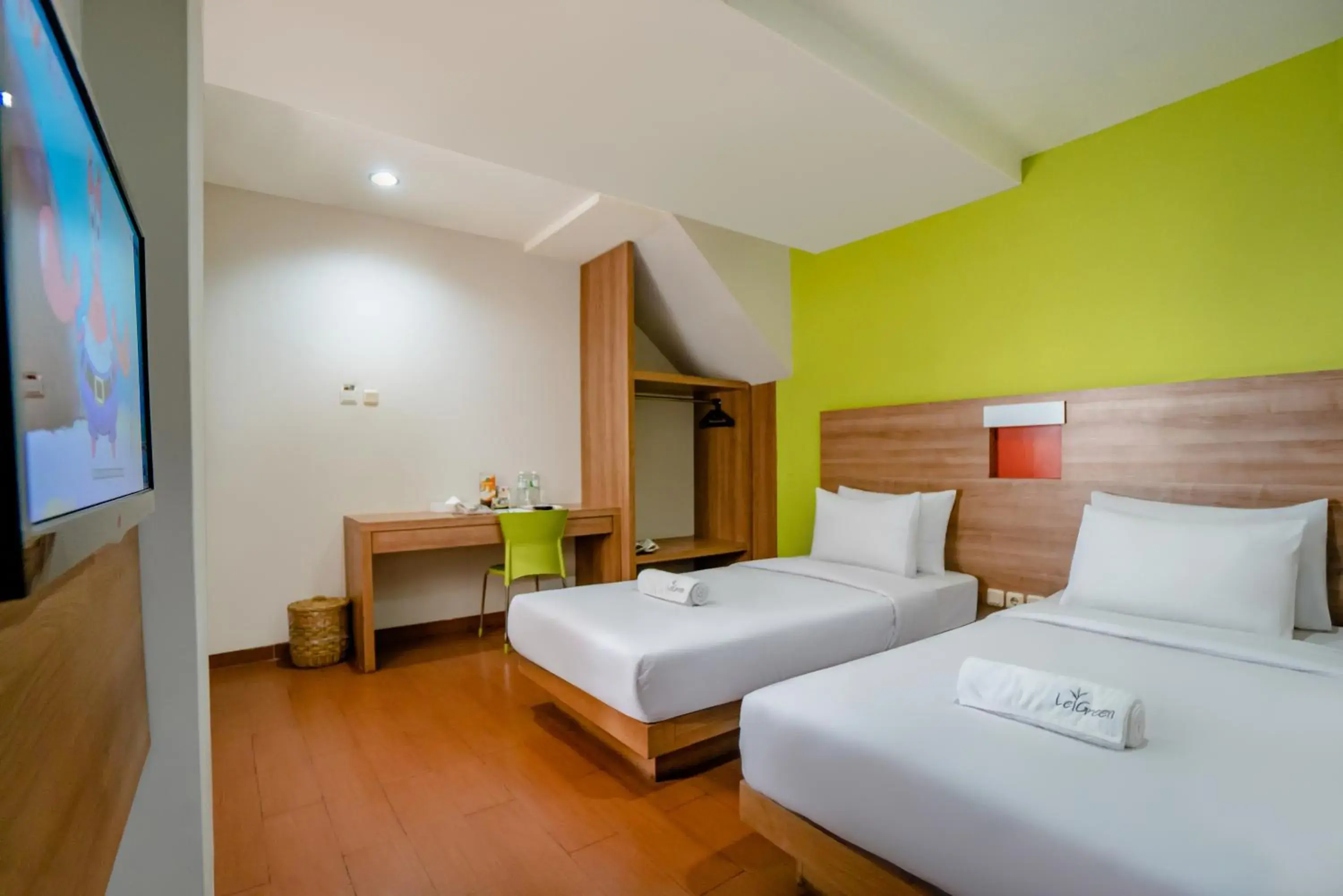 Bed in LeGreen Suite Setiabudi