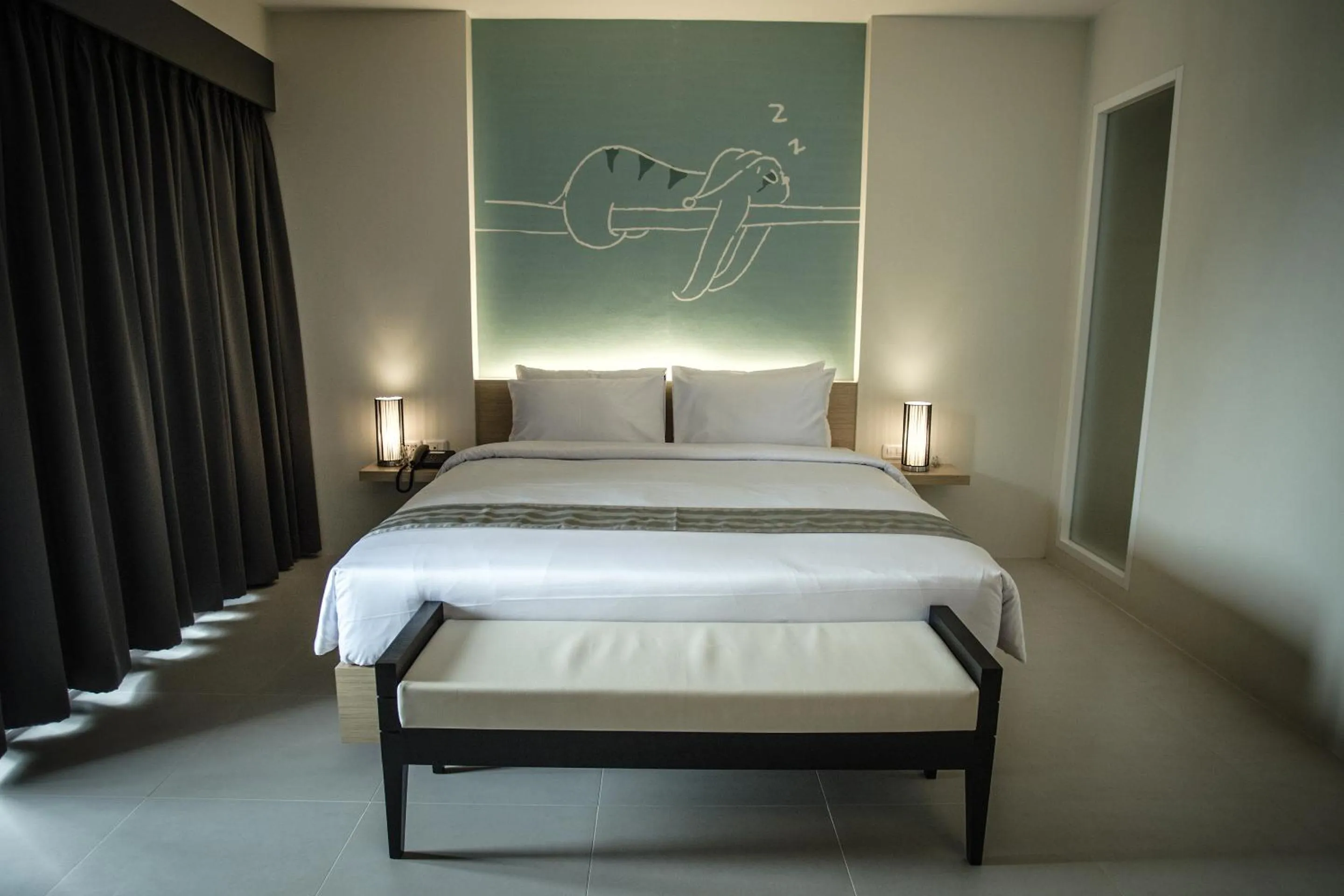 Bed in TIRAS Patong Beach Hotel