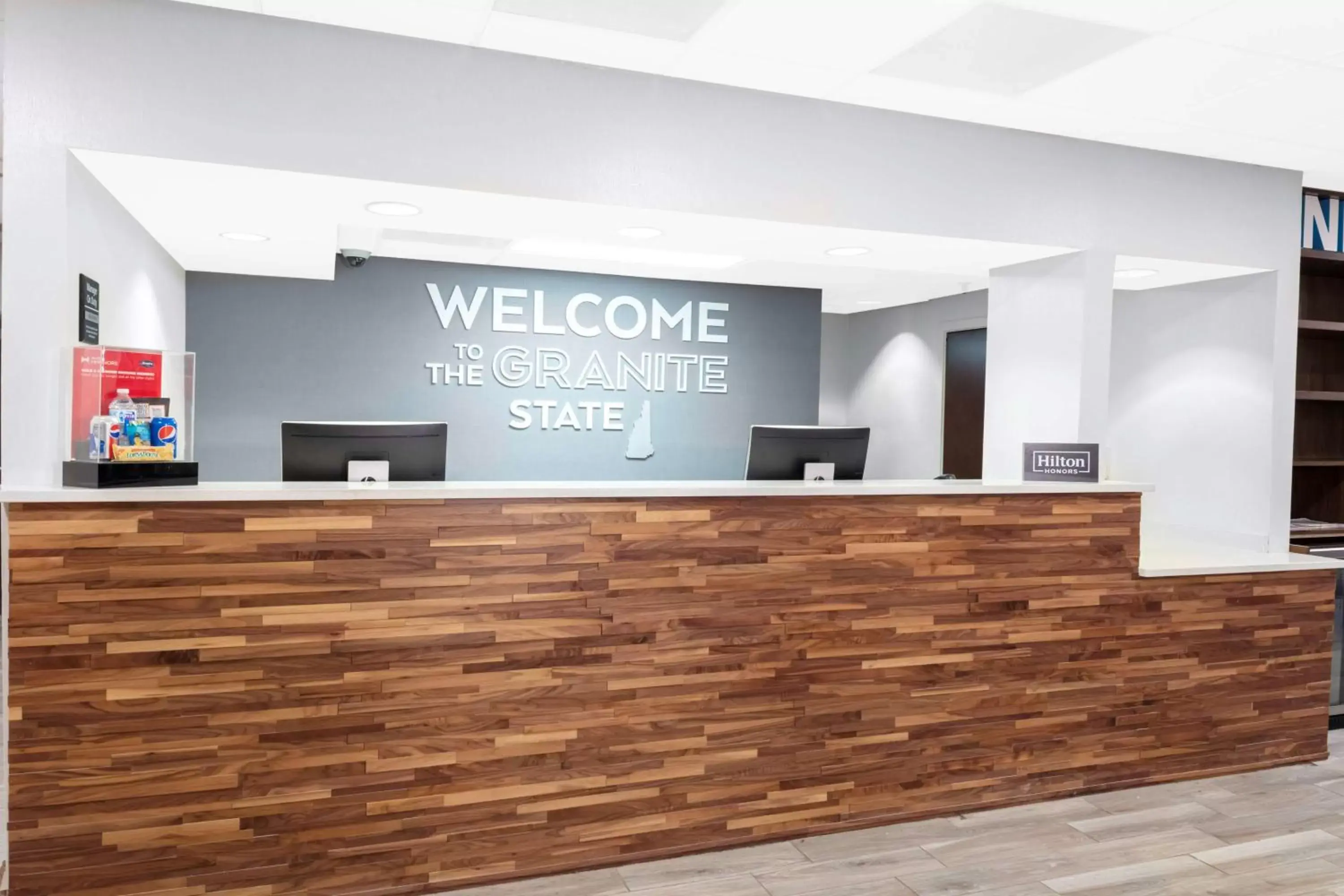 Lobby or reception in Hampton Inn by Hilton Concord/Bow Lobby or reception in Hampton Inn by Hilton Concord/Bow