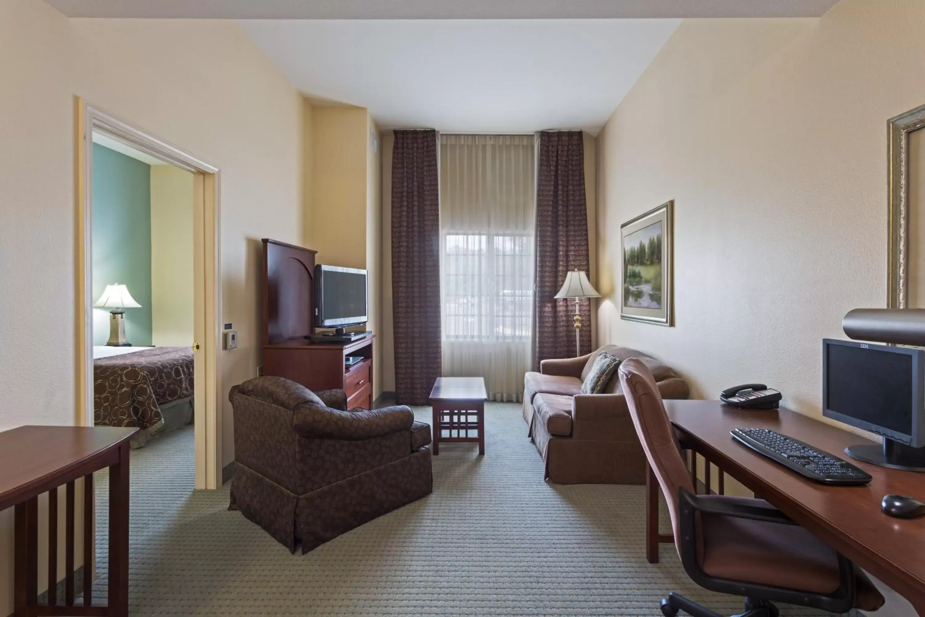 Photo of the whole room, Seating Area in Staybridge Suites Tallahassee I-10 East, an IHG Hotel