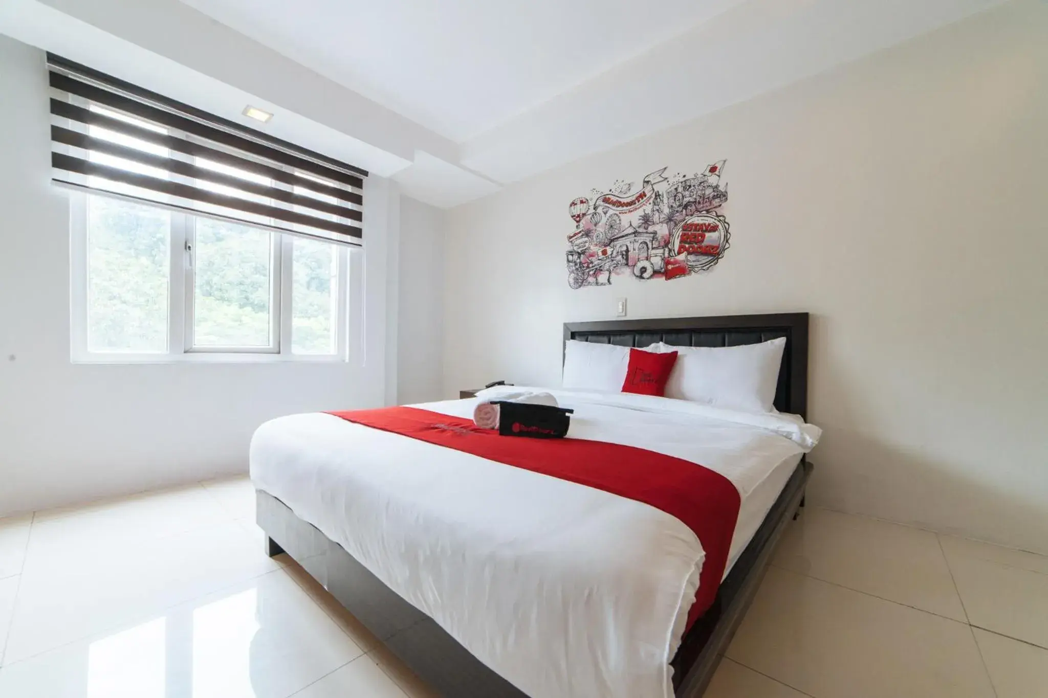 Bed in RedDoorz Plus at One Liberty Hotel Kalayaan Avenue