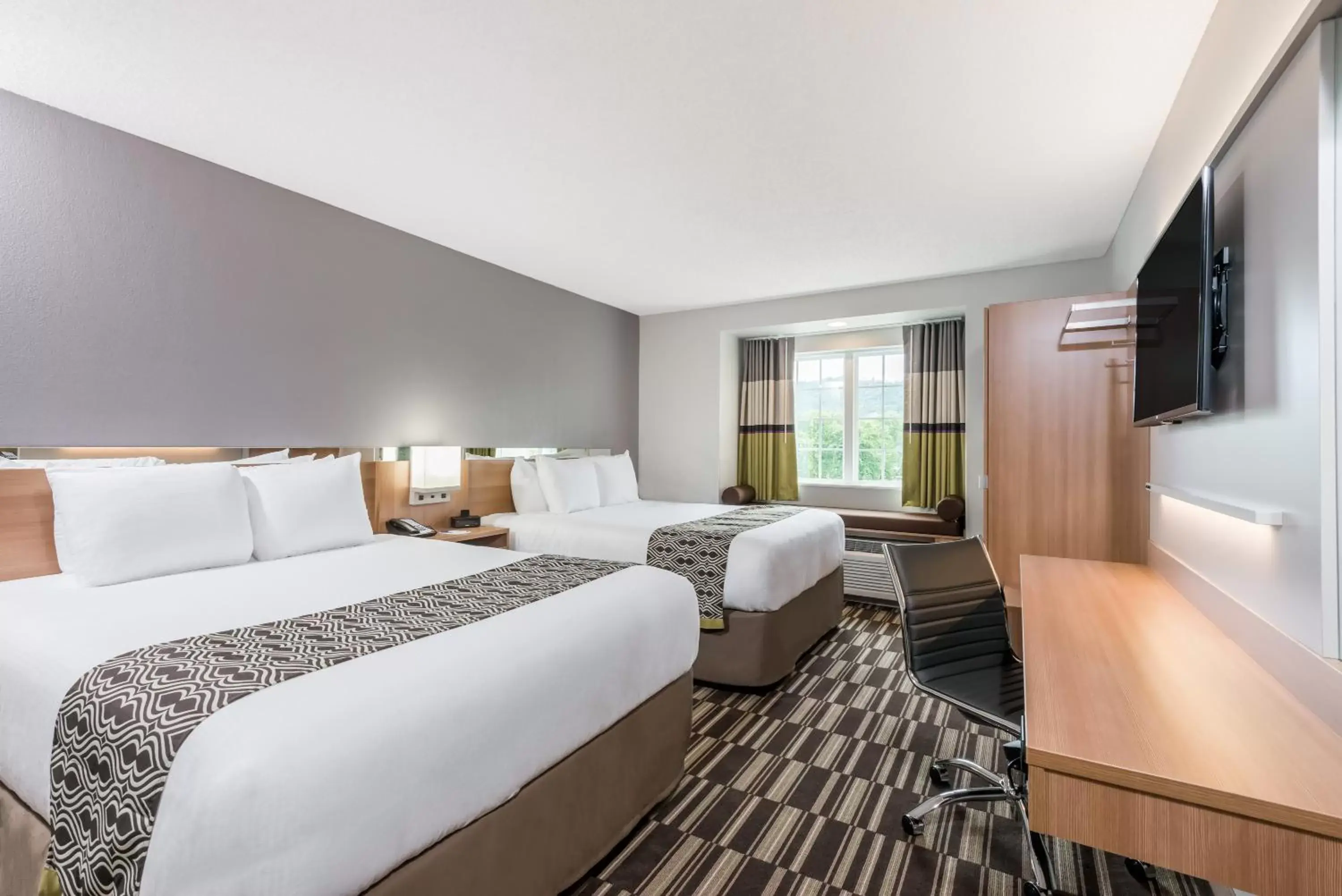 Bed in Microtel Inn & Suites by Wyndham New Martinsville
