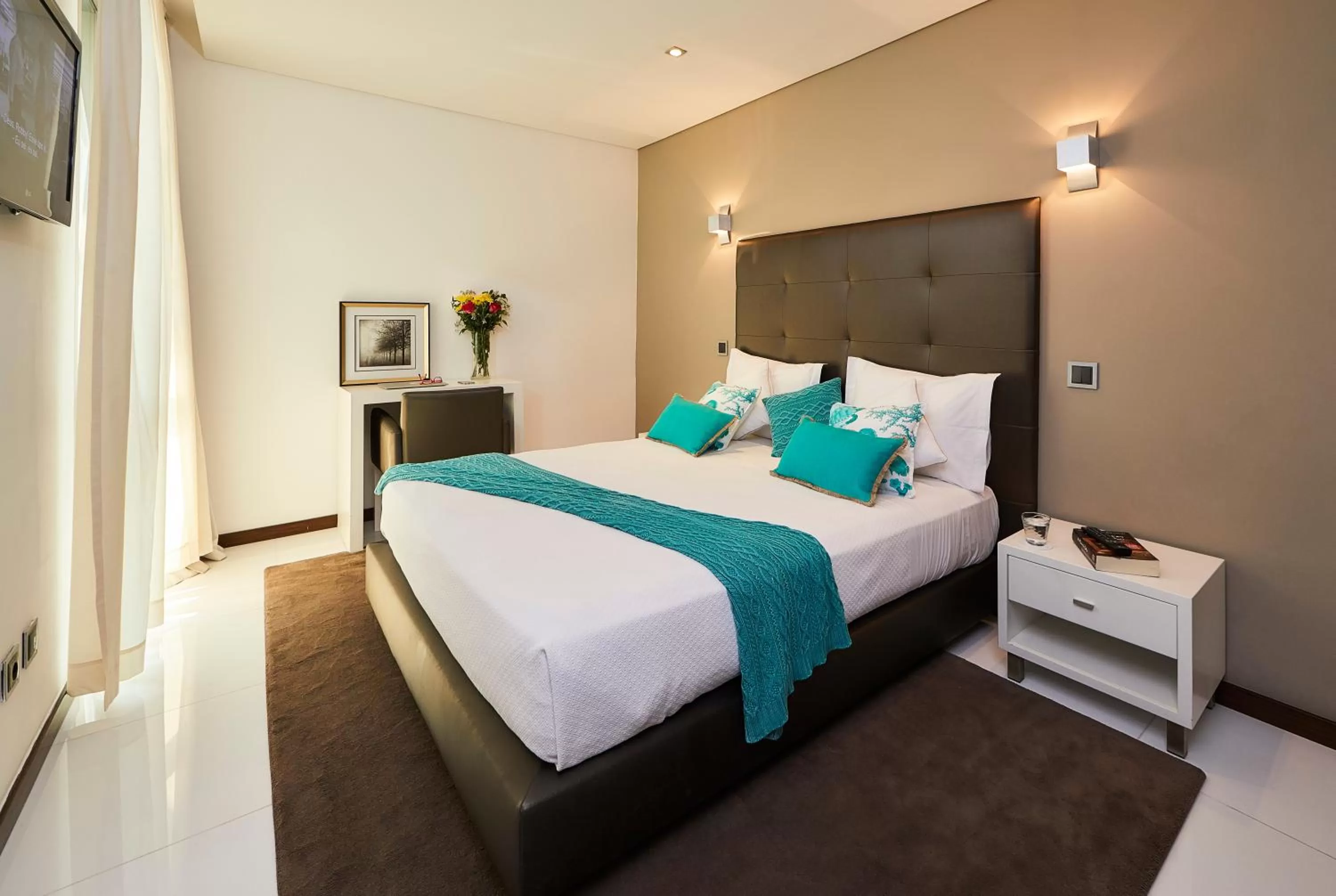 Bed in RK Suite Hotel