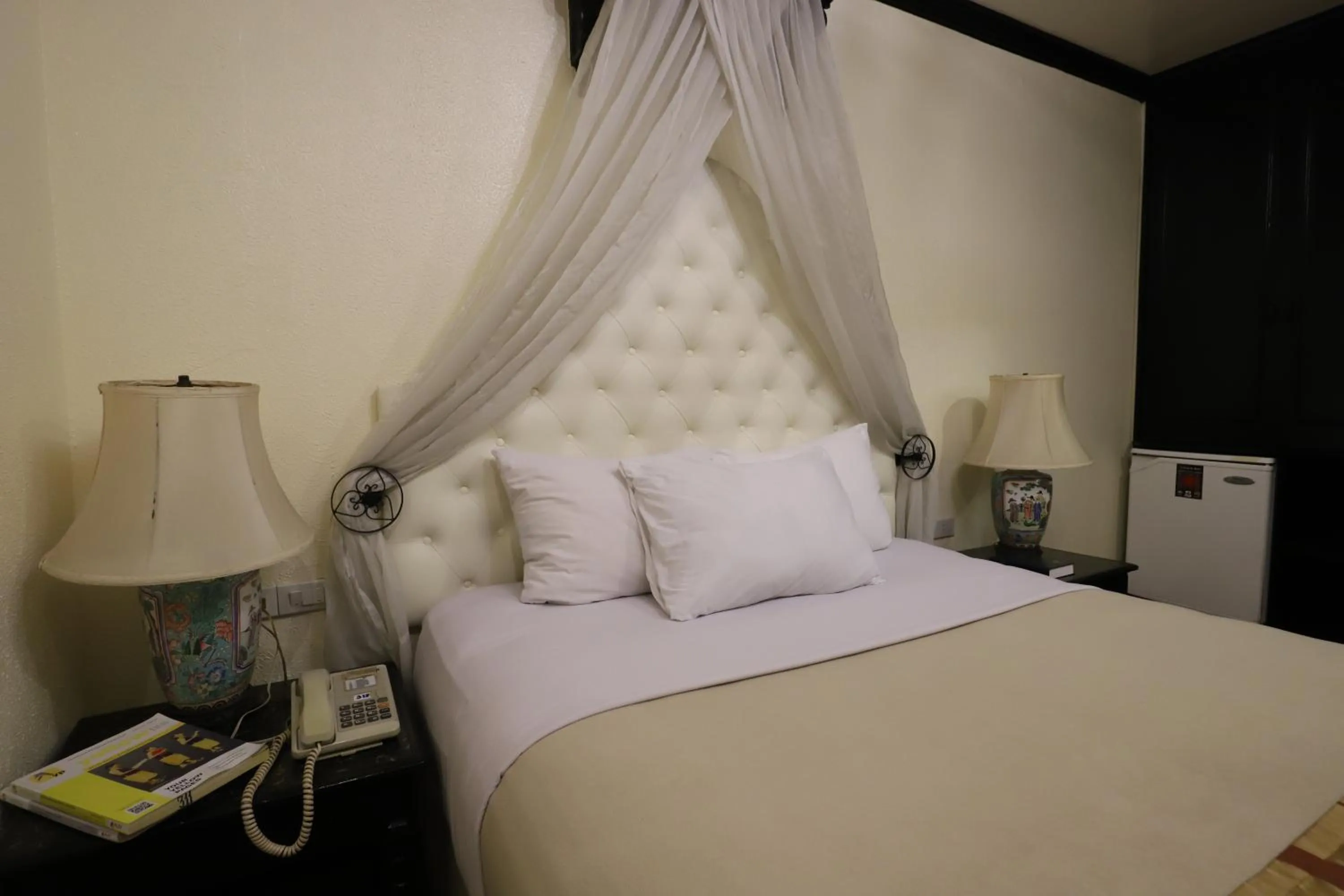 Bed in Camelot Hotel