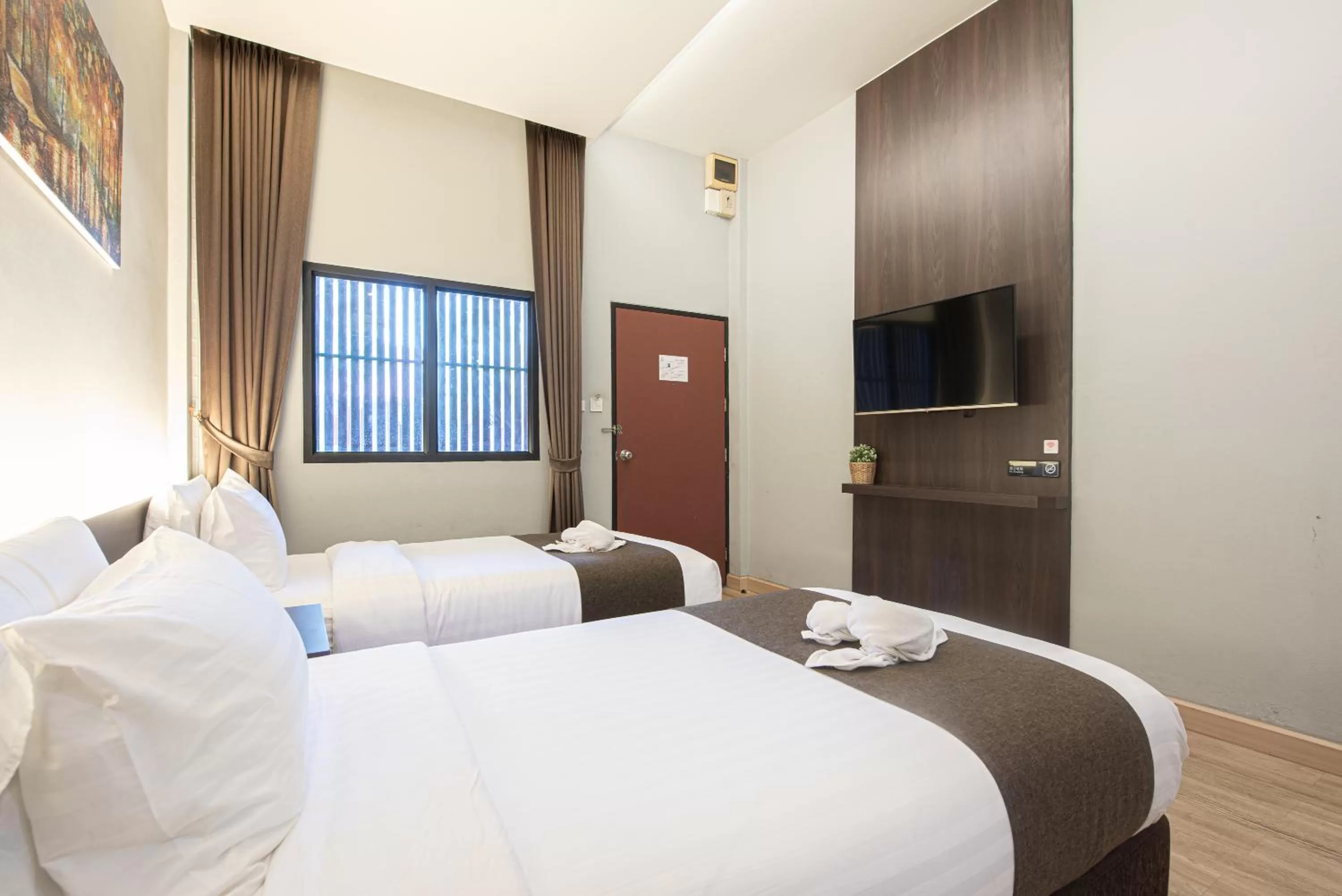 Bed in Tarnsiri Boutique Resort