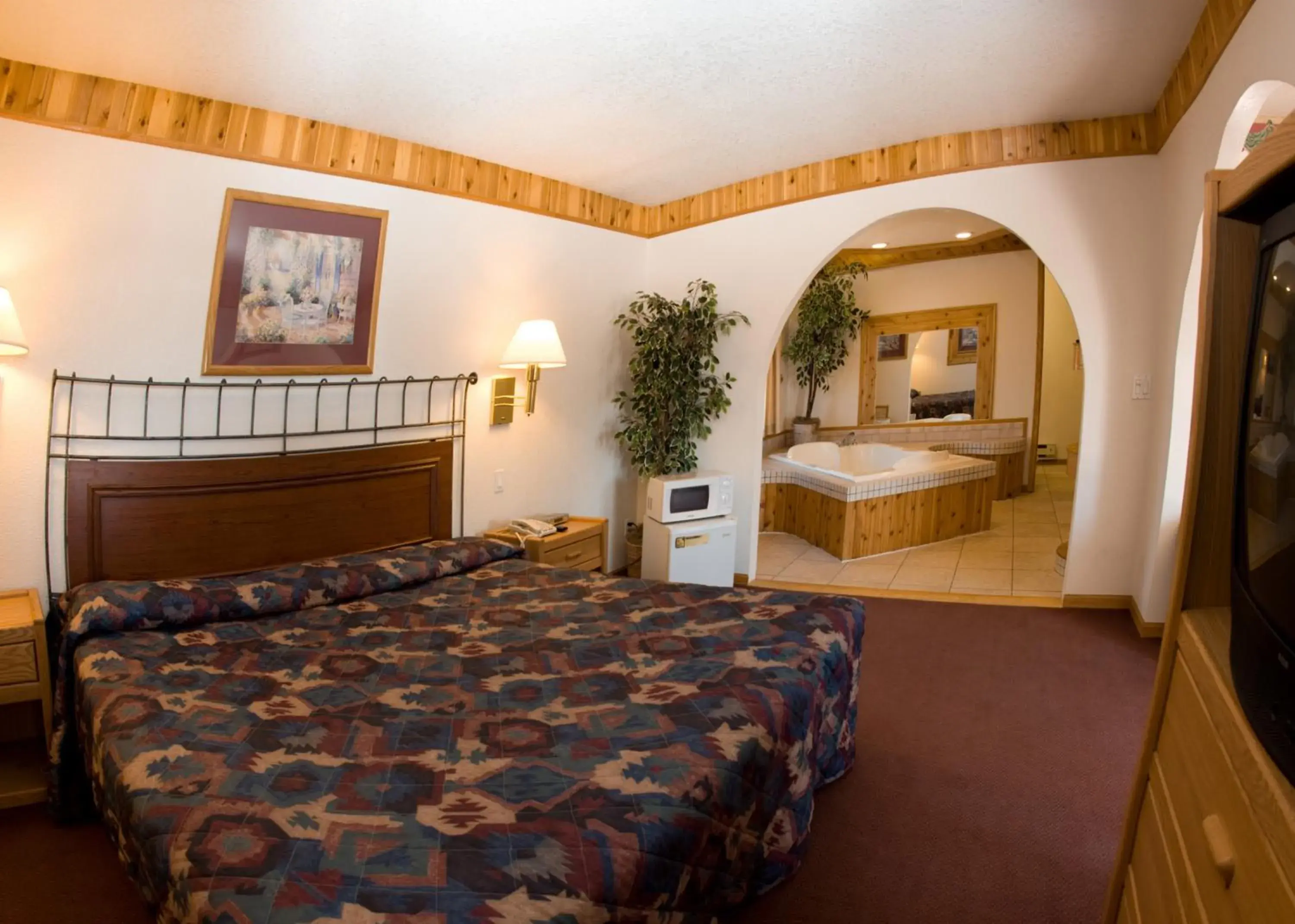 Bed in North Country Inn And Suites