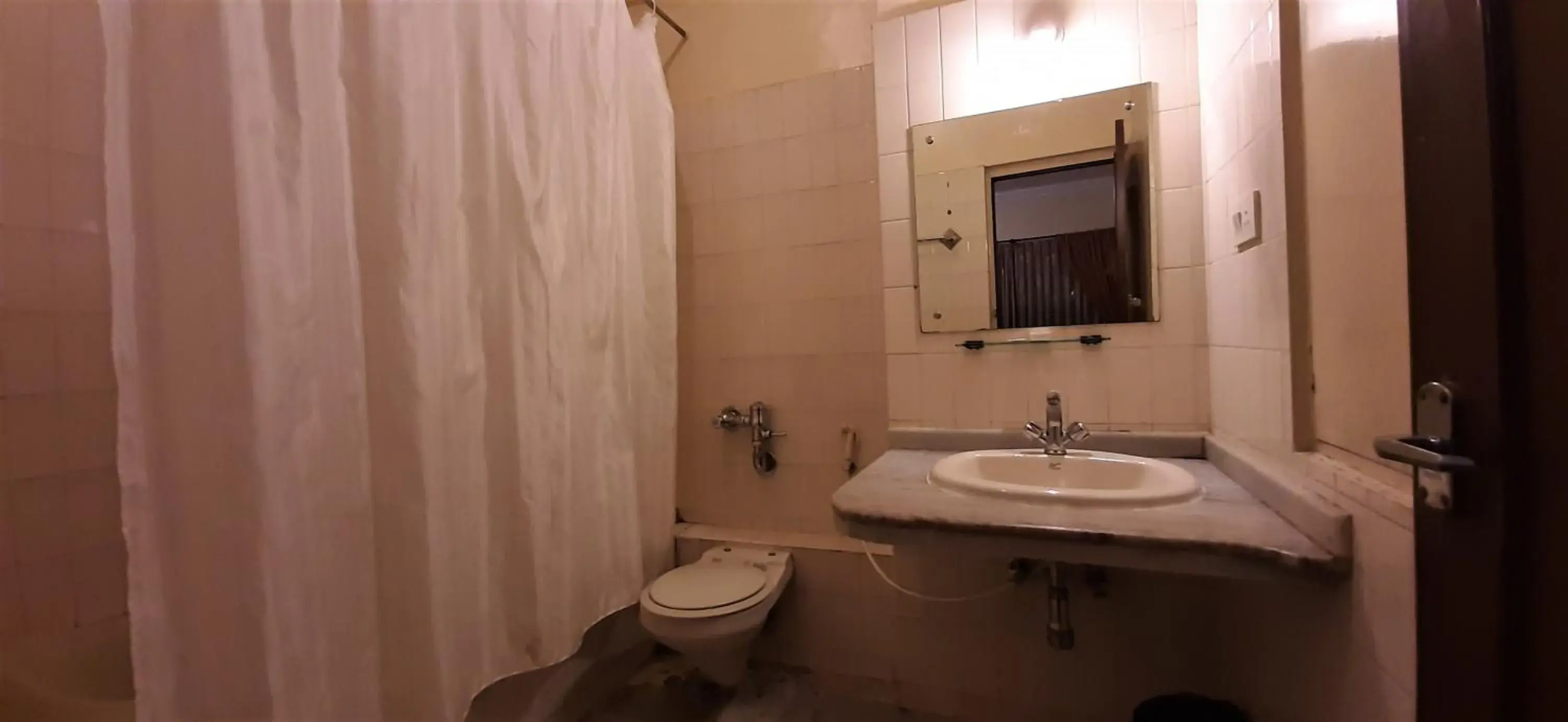 Toilet, Bathroom in Hotel Mangalore International