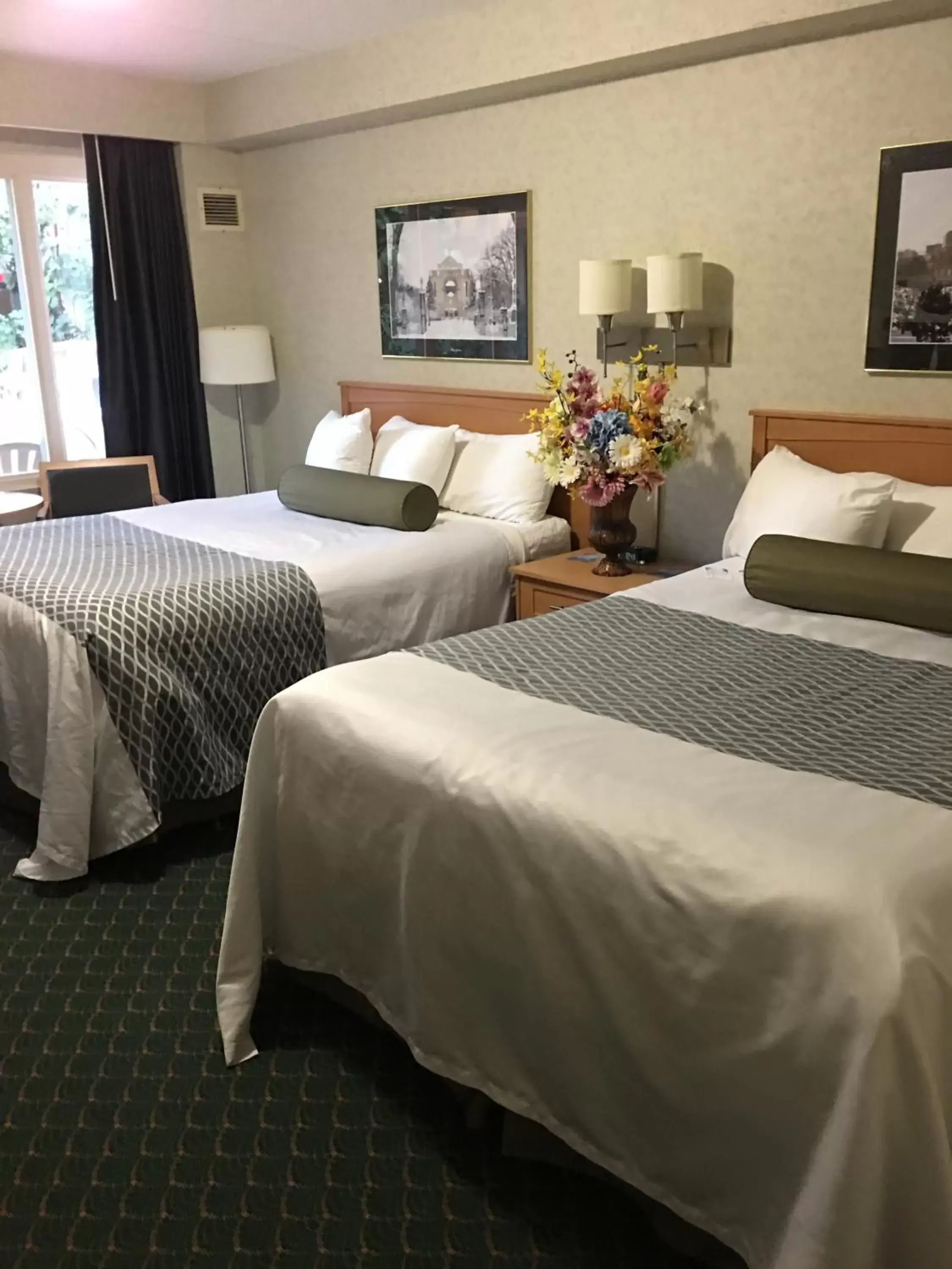 Pool view, Bed in Travelodge by Wyndham Winnipeg East Pool view, Bed in Travelodge by Wyndham Winnipeg East