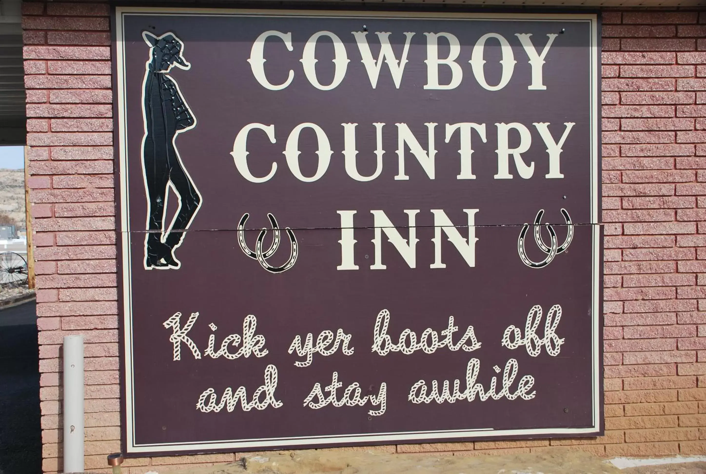 Property logo or sign in Cowboy Country Inn