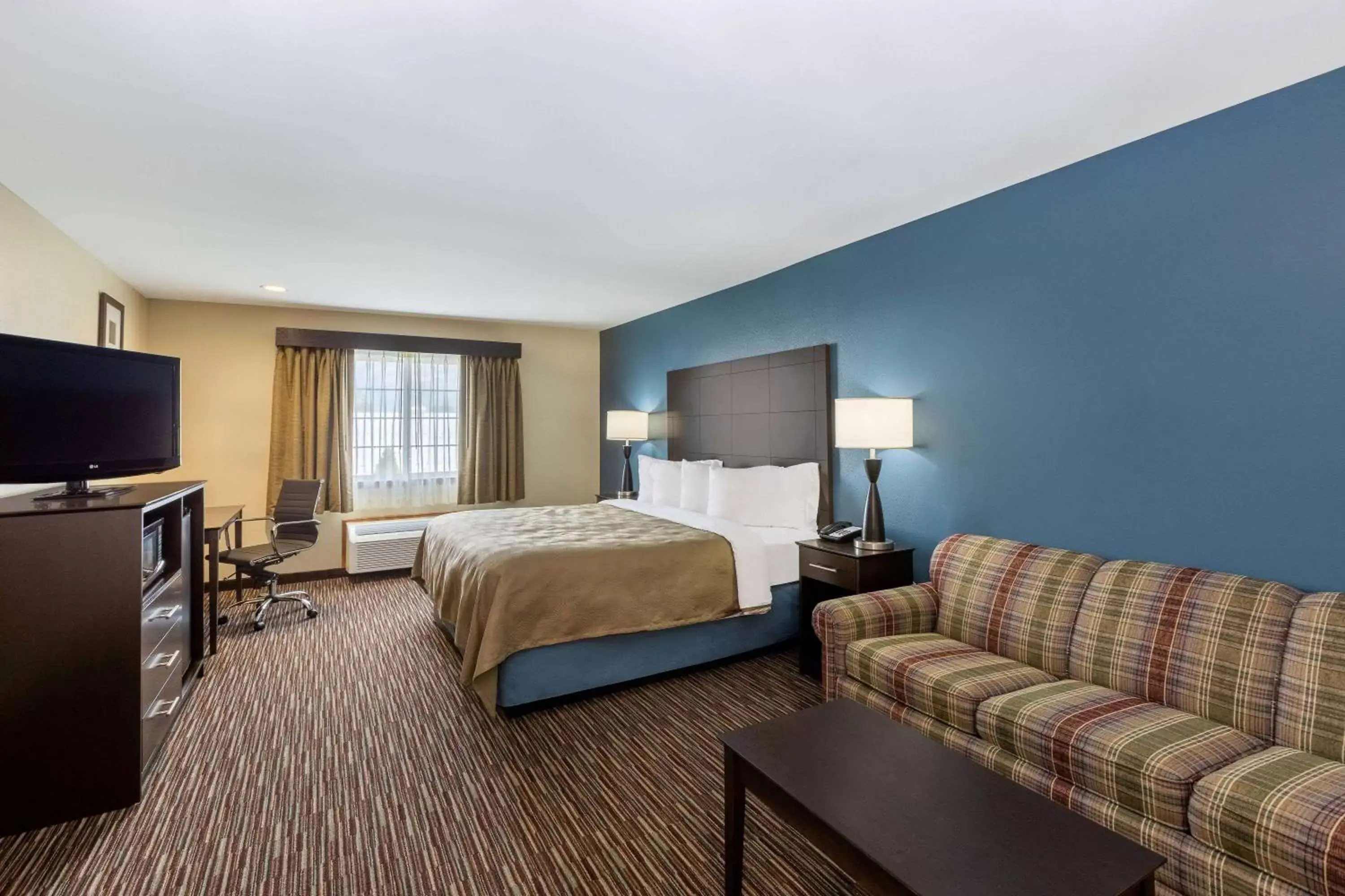 Photo of the whole room, TV/Entertainment Center in AmericInn by Wyndham Jefferson