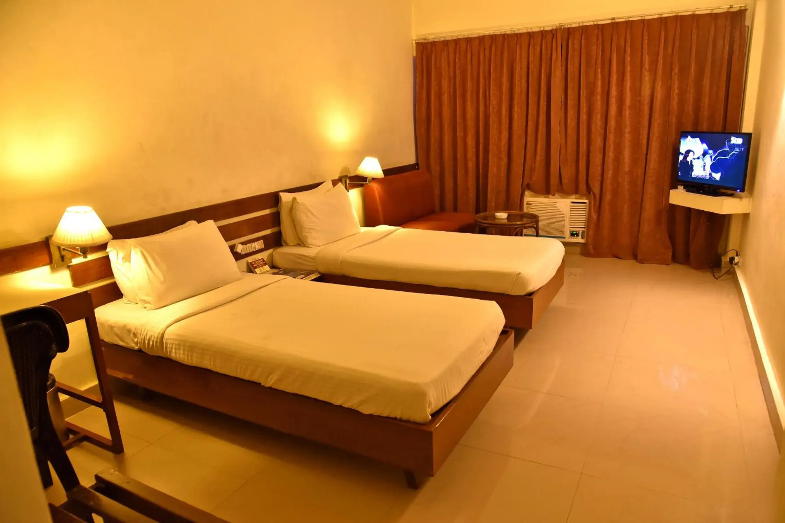 Shower, Bed in Hotel Poonja International