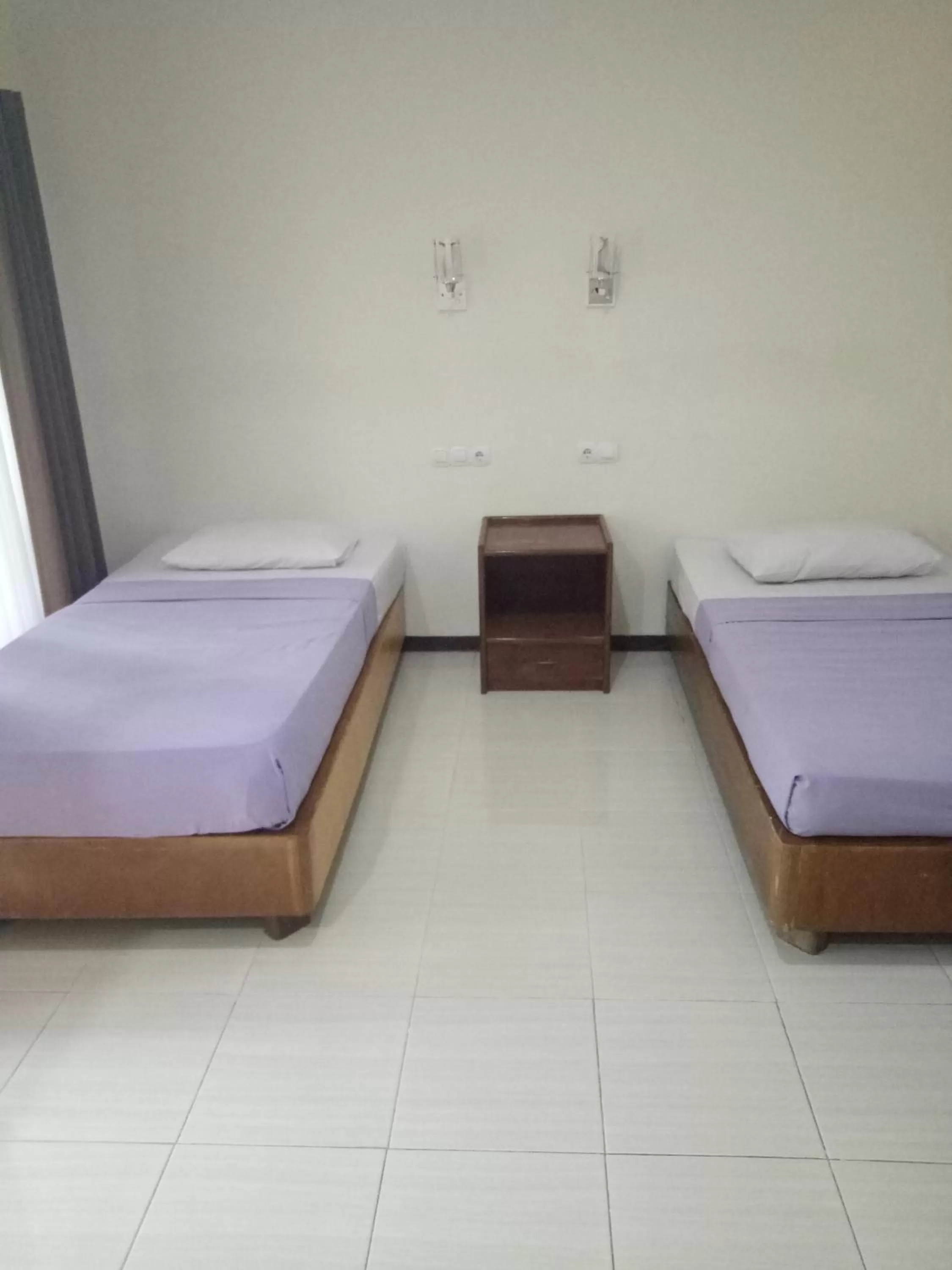 Bed in Astina Hotel