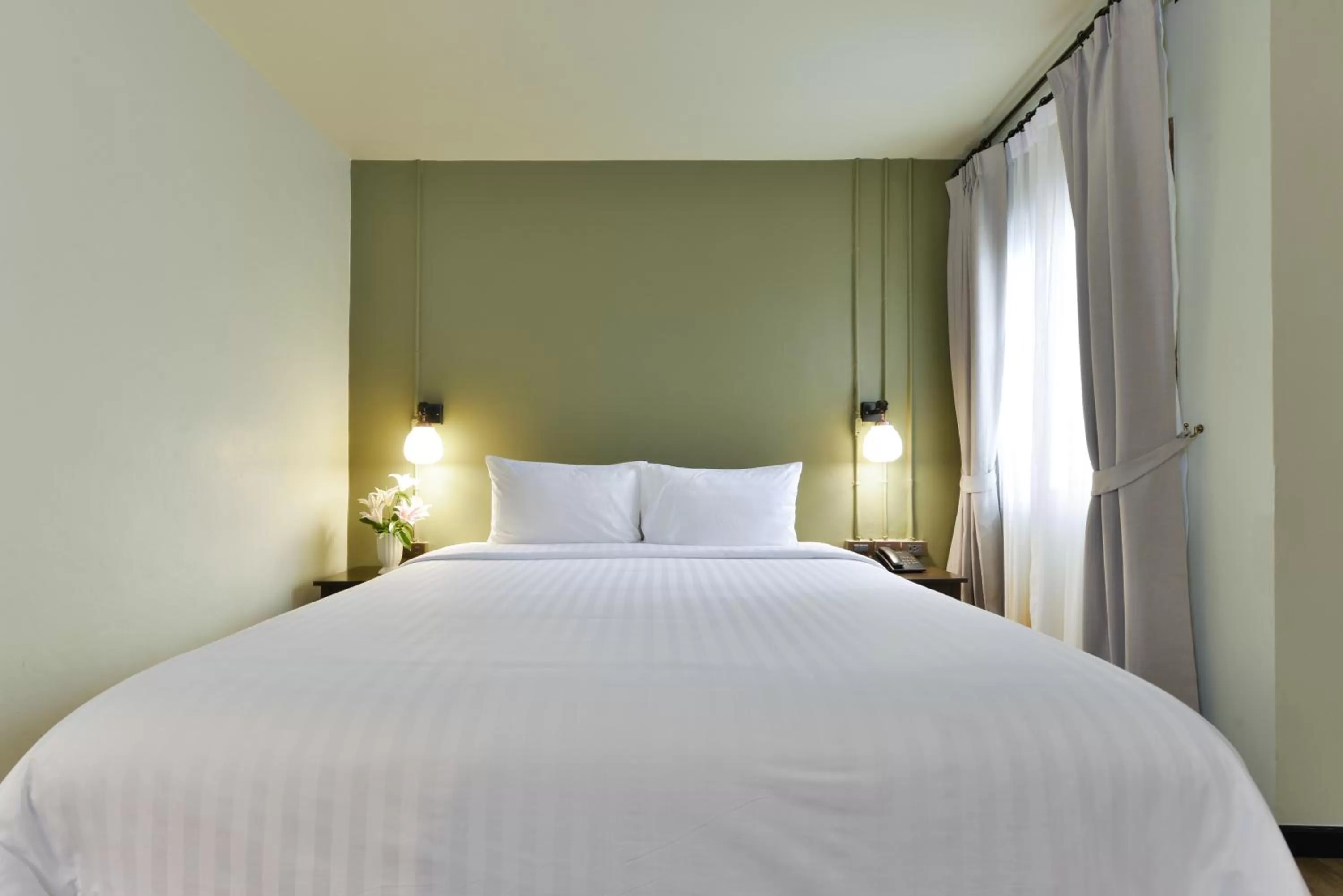 Bed in Oldthaiheng Hotel