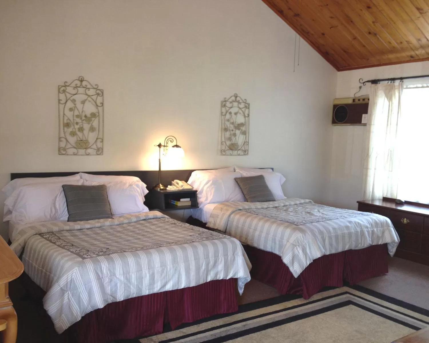 Bedroom in Vinehurst Inn & Suites