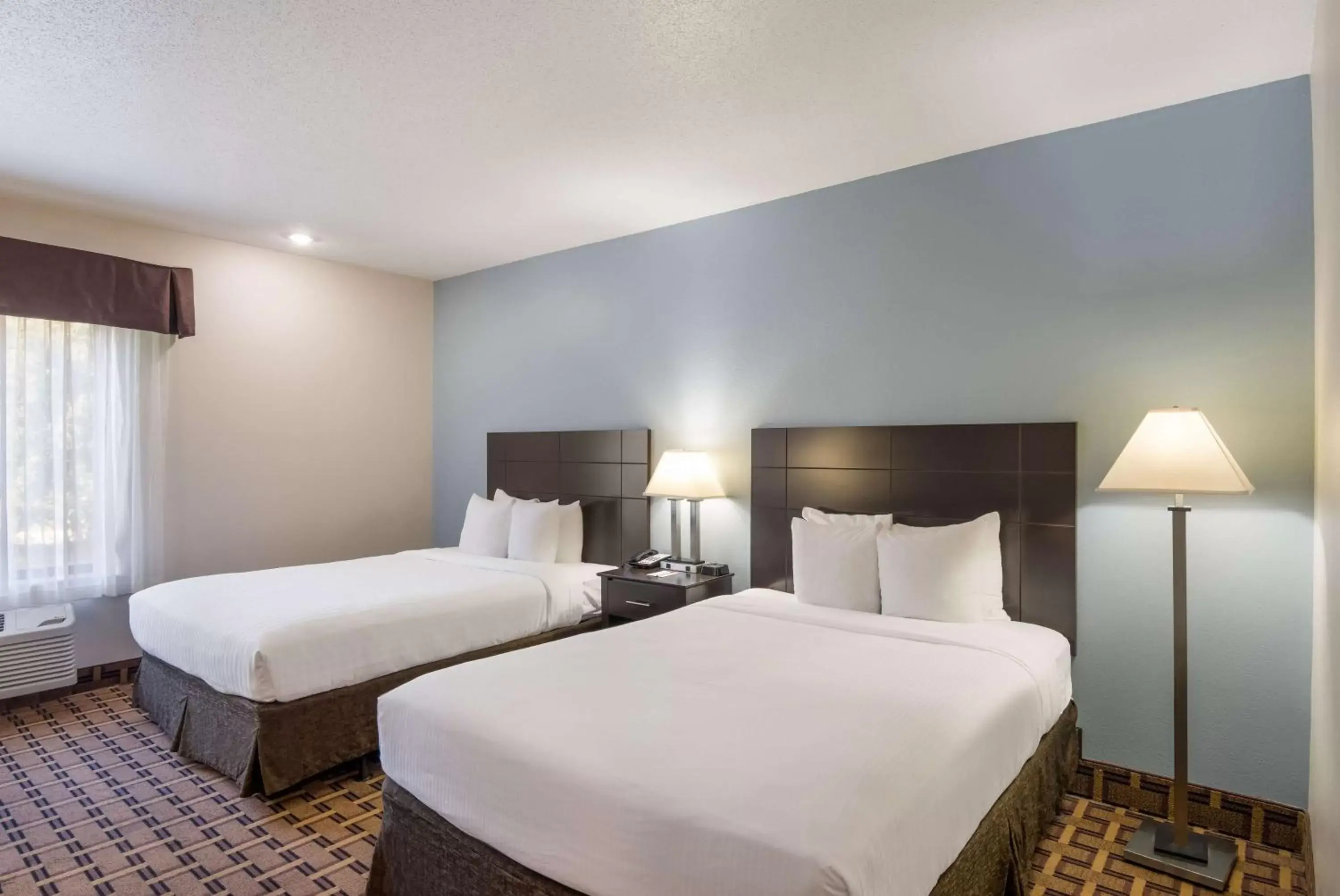 Bedroom, Bed in SureStay Plus Hotel by Best Western Coralville Iowa City