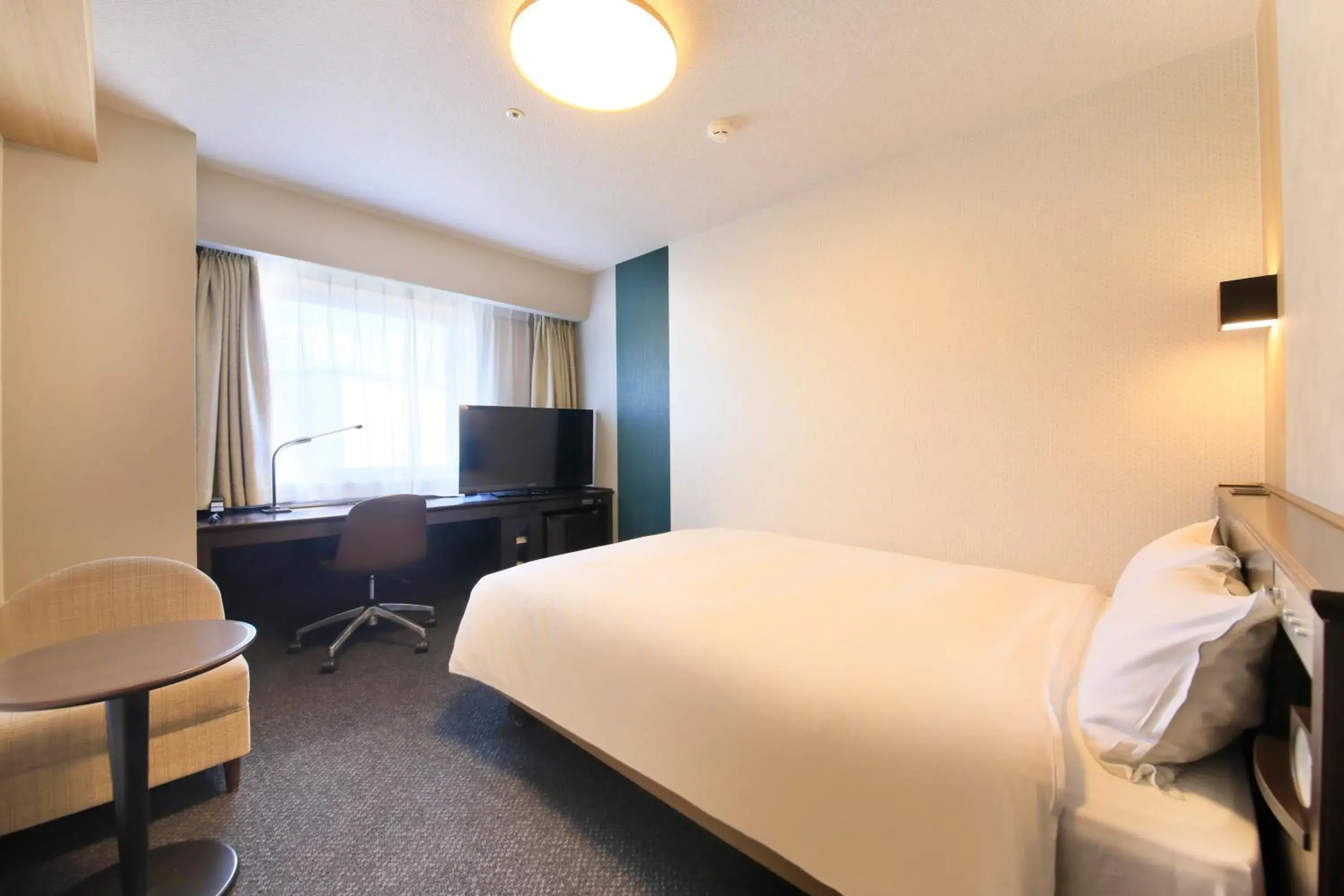 Bed, TV/Entertainment Center in Richmond Hotel Yamagata-Ekimae