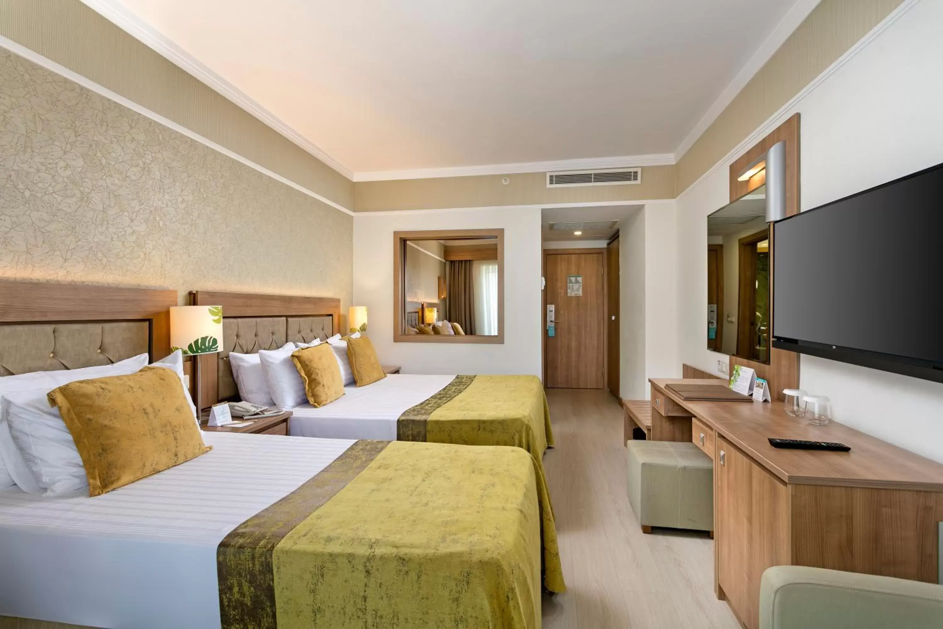 Communal lounge/ TV room, Bed in Innvista Hotels Belek
