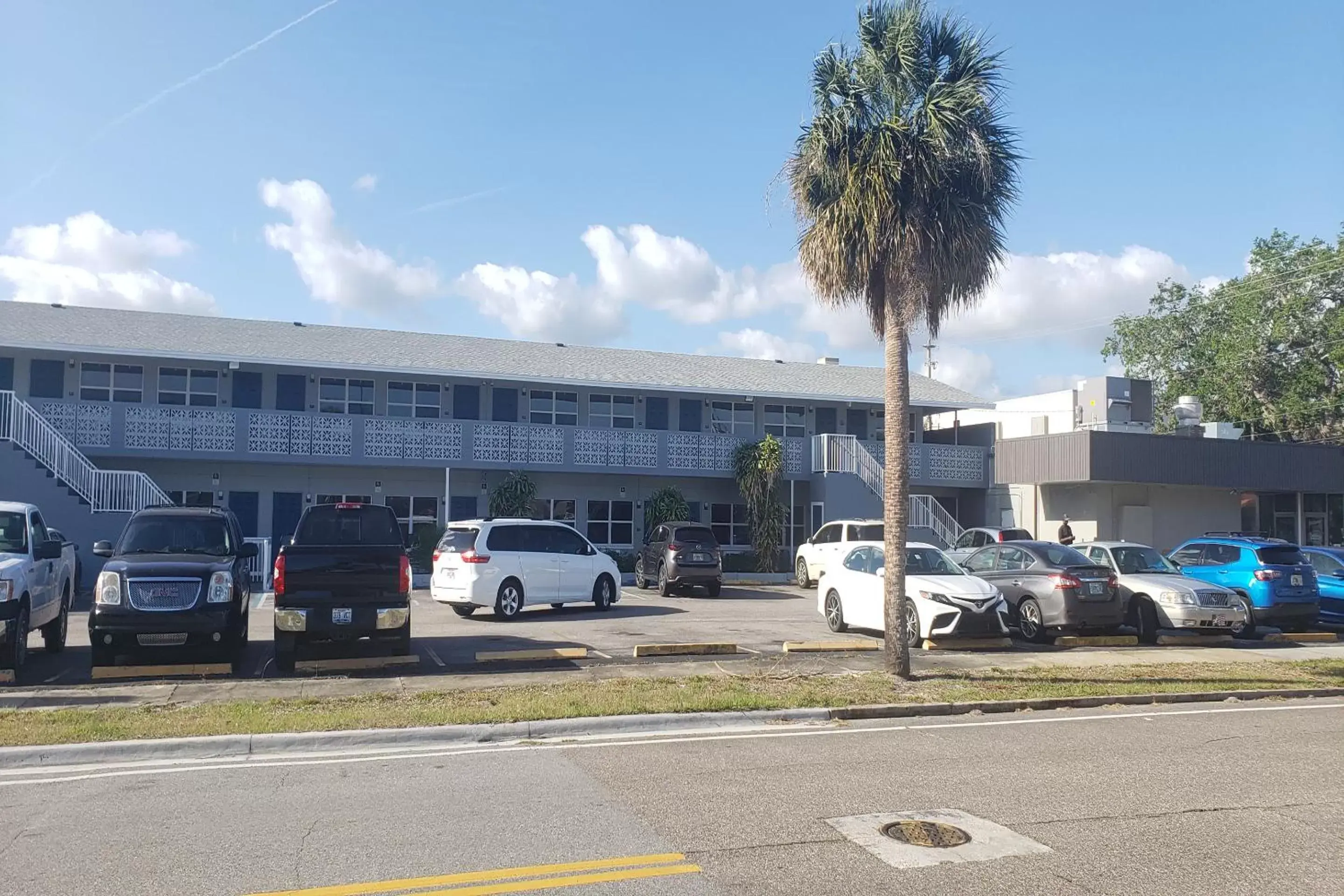 Parking, Property Building in Sunrise Inn by OYO Titusville FL