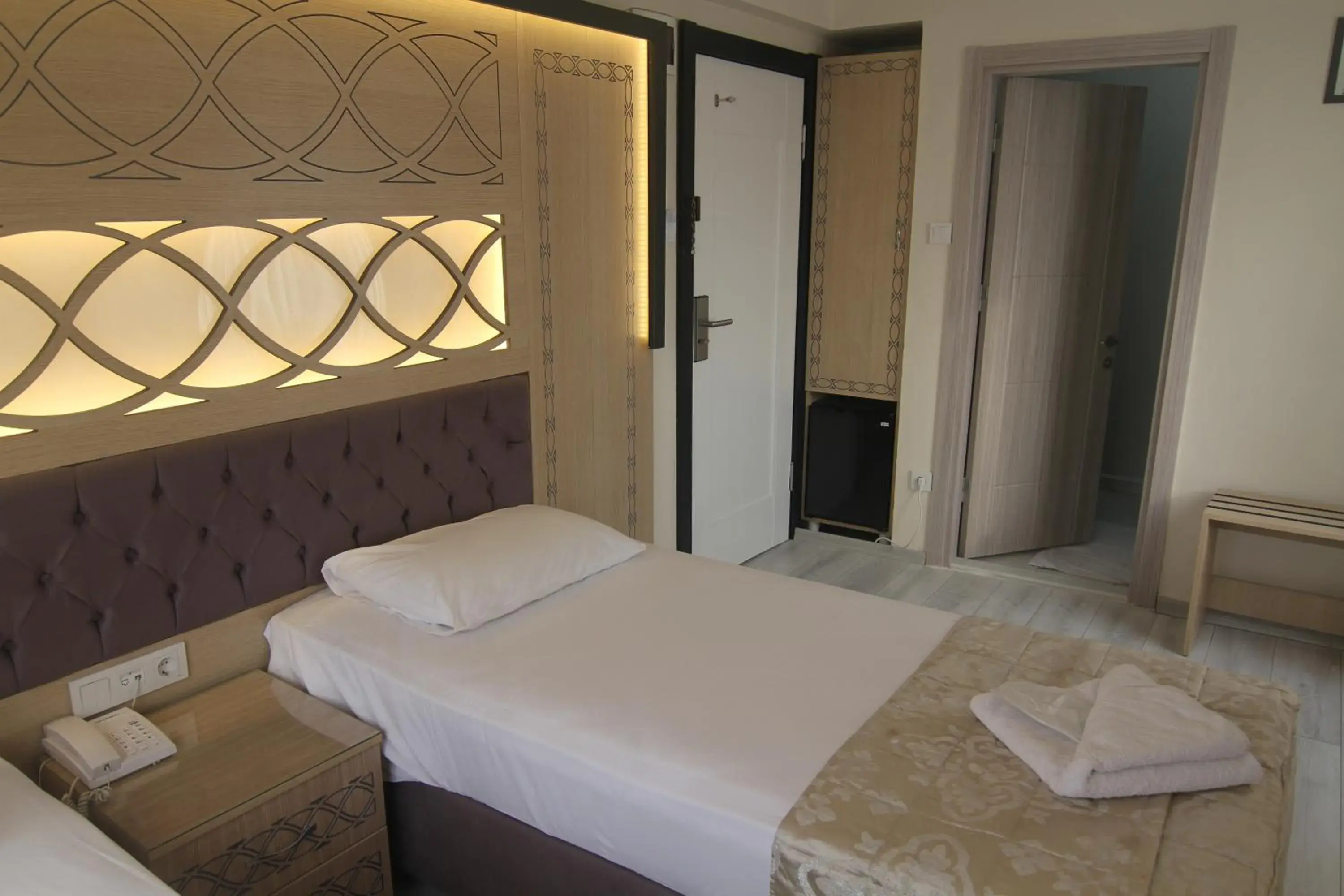 Bed in Grand Liza Hotel